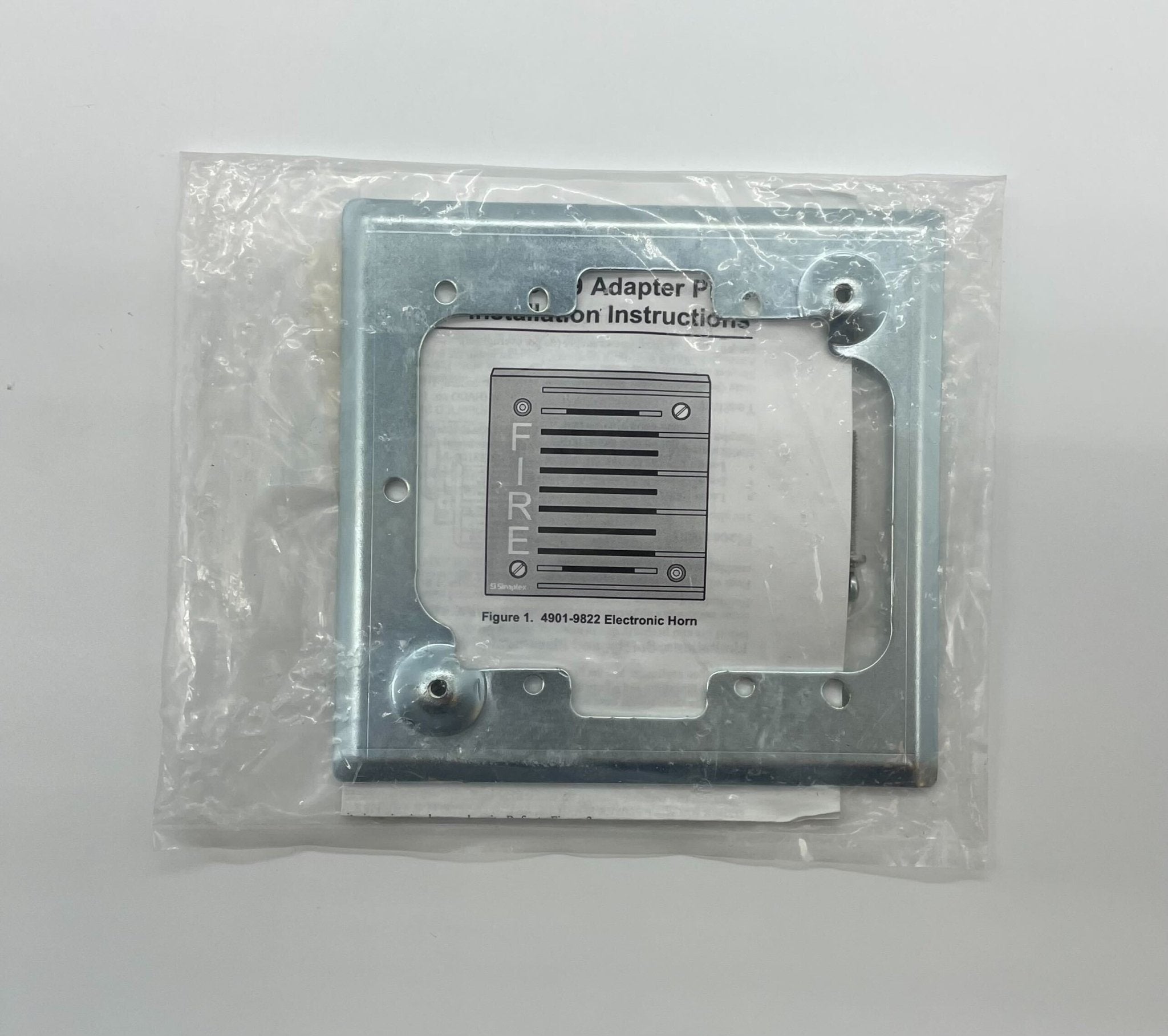 Simplex 4905-9909 fire alarm device from Simplex, showing its compact, wall-mounted design with test and alarm indicators.