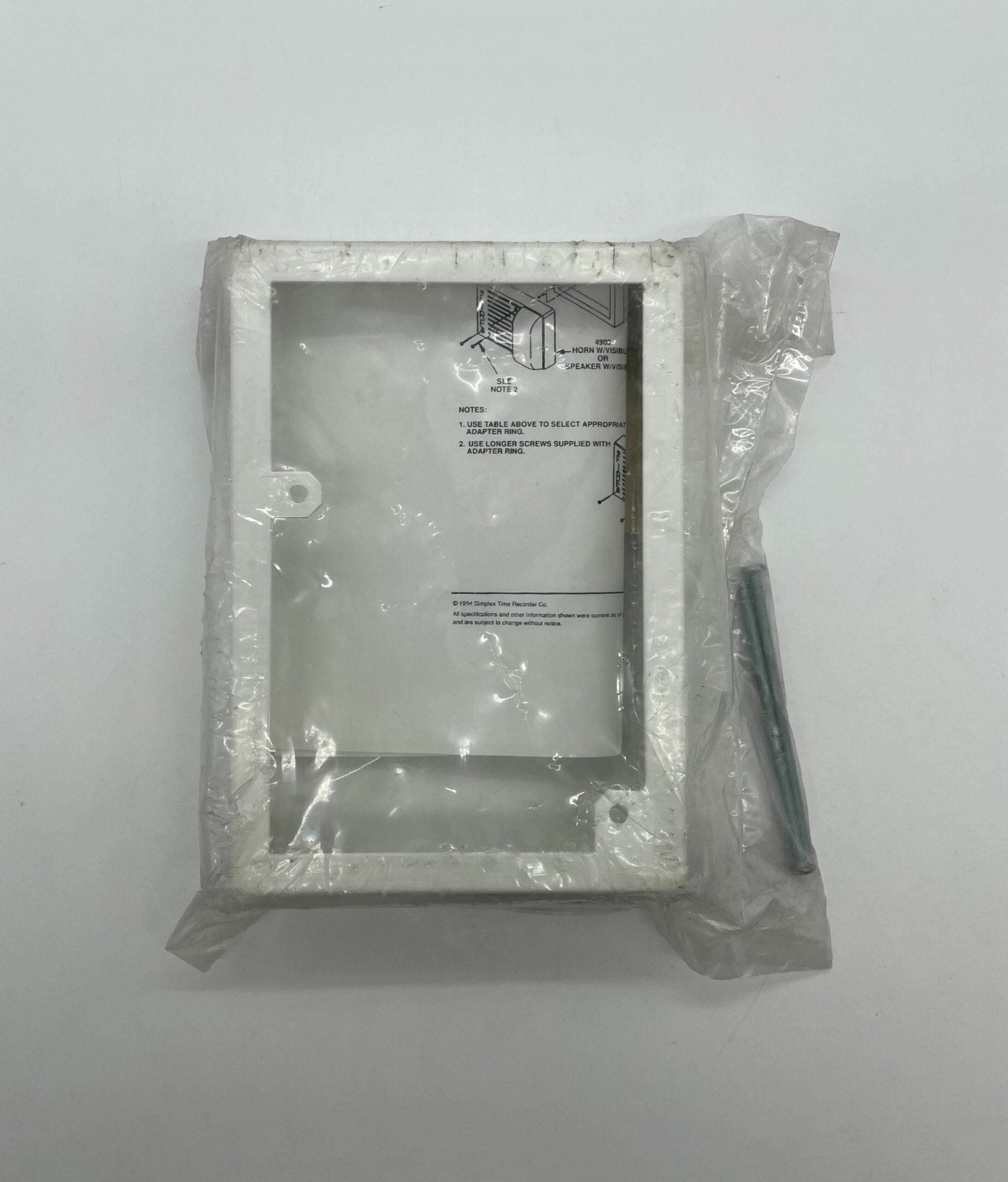 Simplex 4905-9915 fire alarm with alarm horn and sensor, mounted on a wall for fire safety.