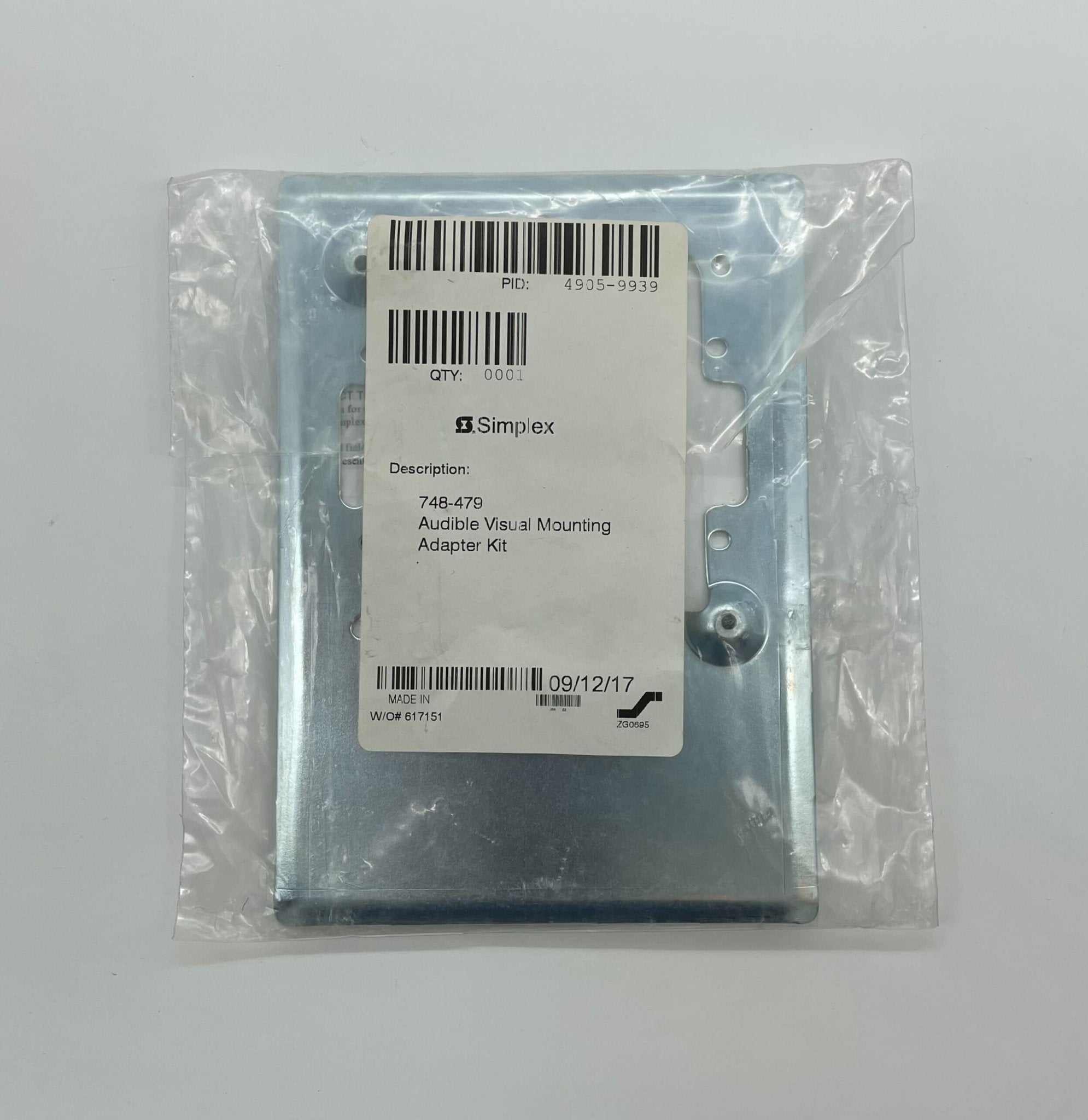 Simplex 4905-9939 fire alarm with white plastic casing and mounting bracket, designed for building fire safety systems.