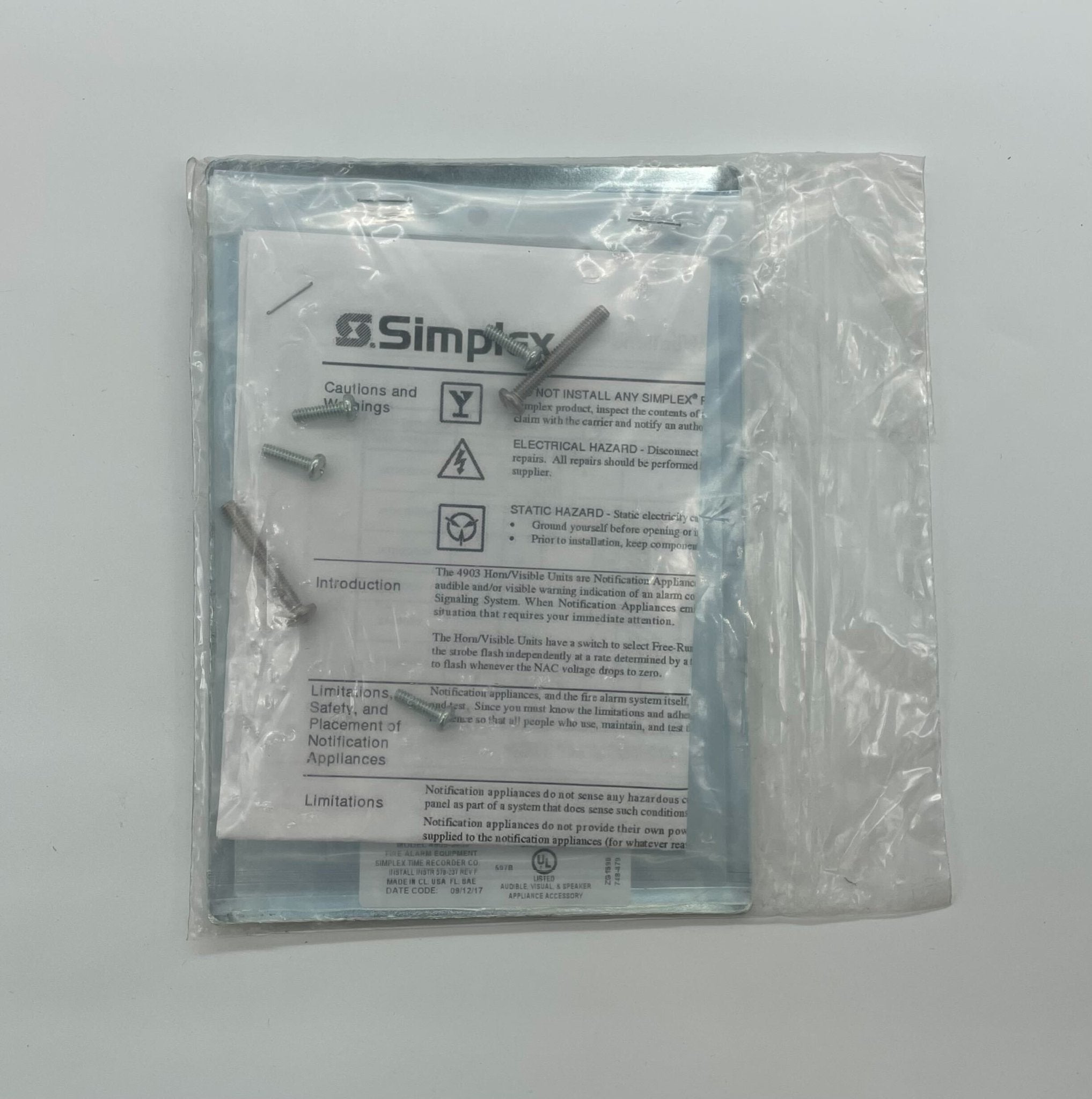 Simplex 4905-9939 fire alarm with a white detection unit and test button, designed for fire safety systems.