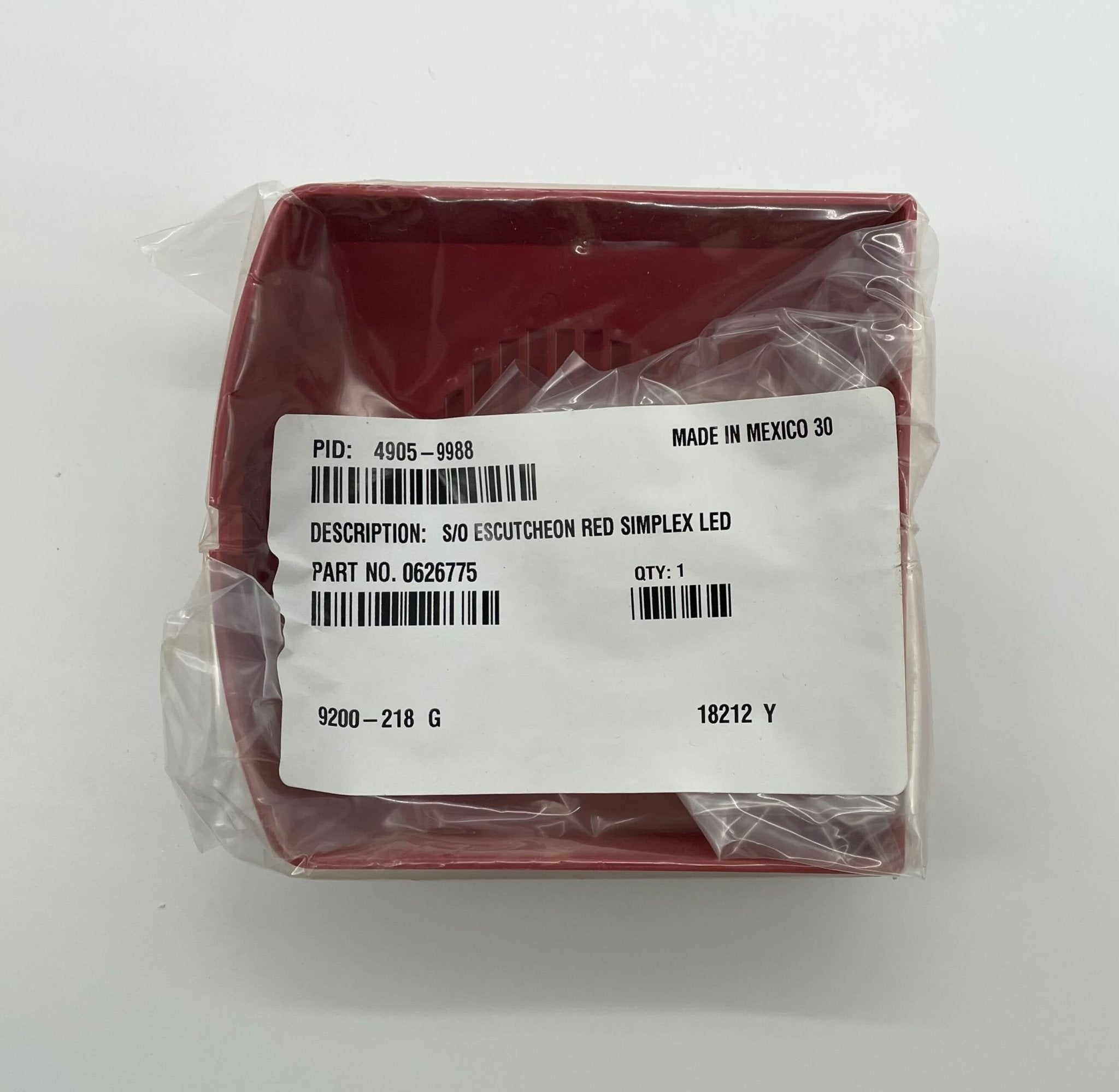 Simplex 4905-9988 cover, black protective cover for fire alarm system, made by Simplex, shown on a wall.