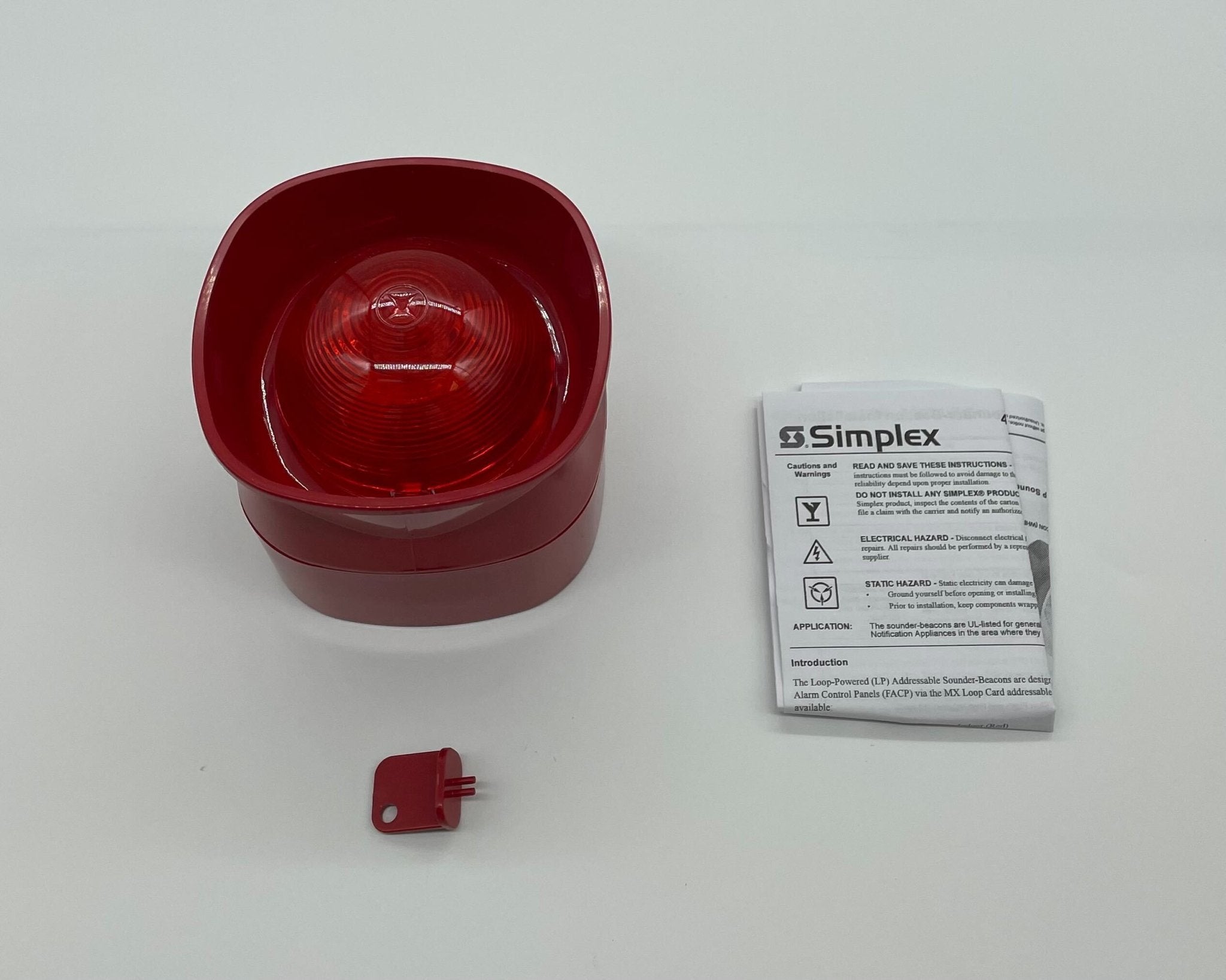 Simplex 4906-5205 beacon with red and clear lenses, mounted on a metal base, used for emergency signaling.