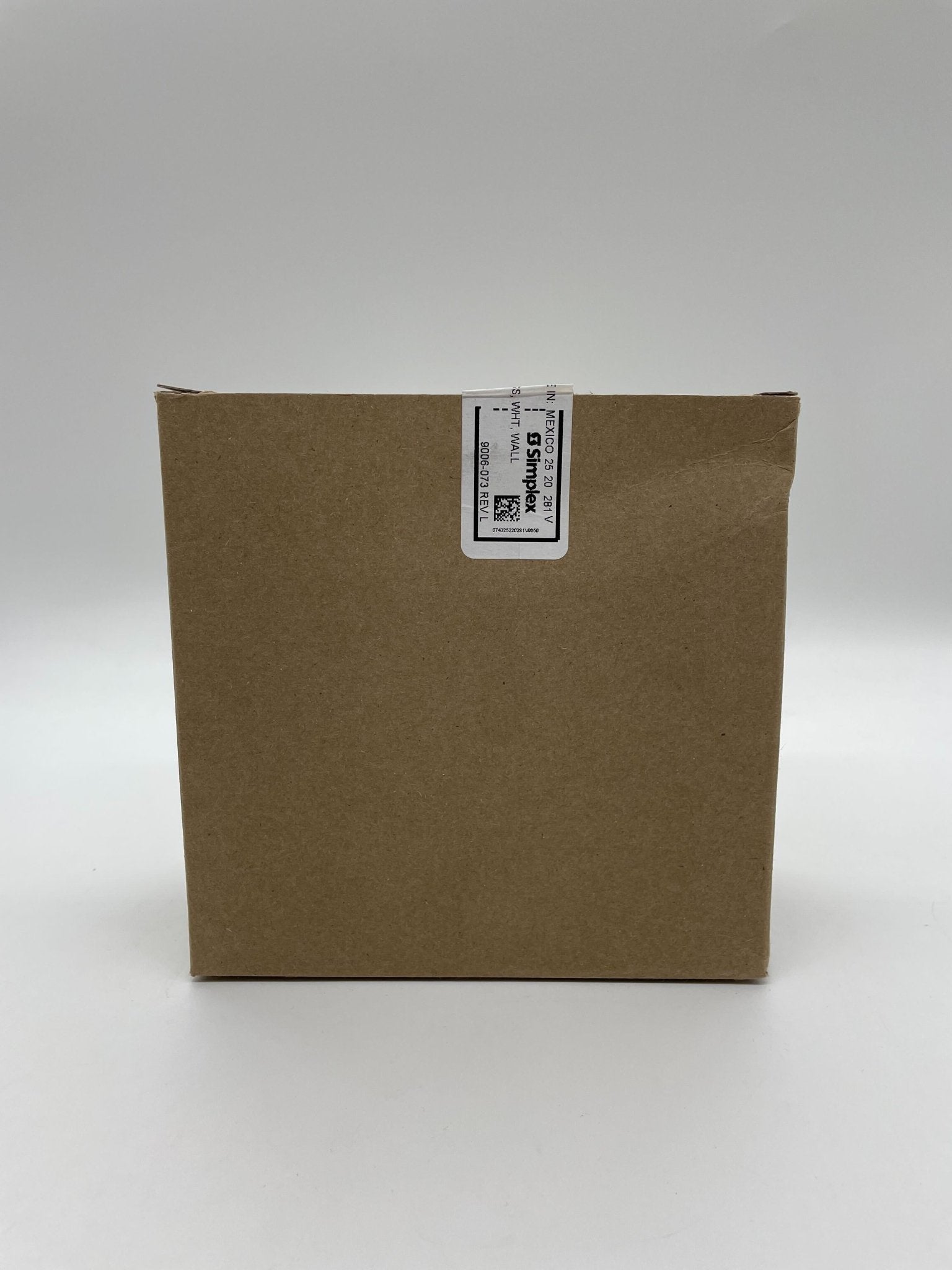 Simplex 4906-9103 fire alarm with white plastic casing and mounting bracket, designed for building safety.
