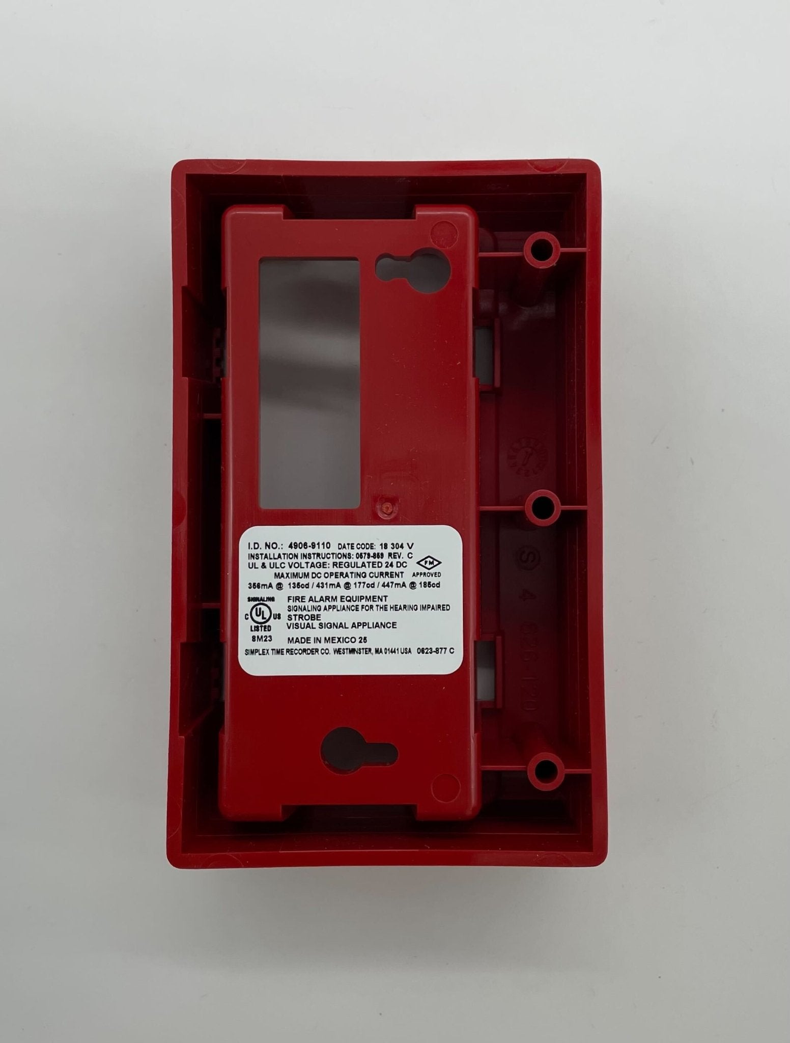 Simplex 4906-9110 fire alarm with white rectangular design and test/reset buttons, mounted on wall for fire safety.