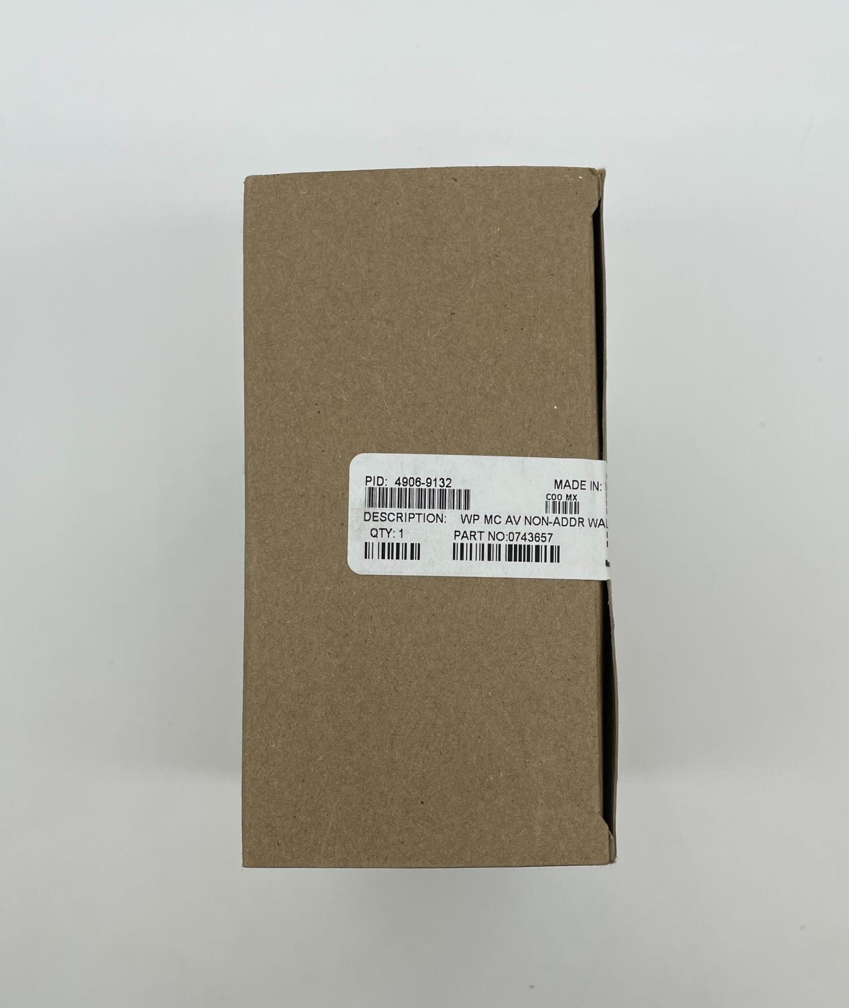 Simplex 4906-9132 horn strobe alarm device mounted on a wall, with visible wiring and mounting hardware.