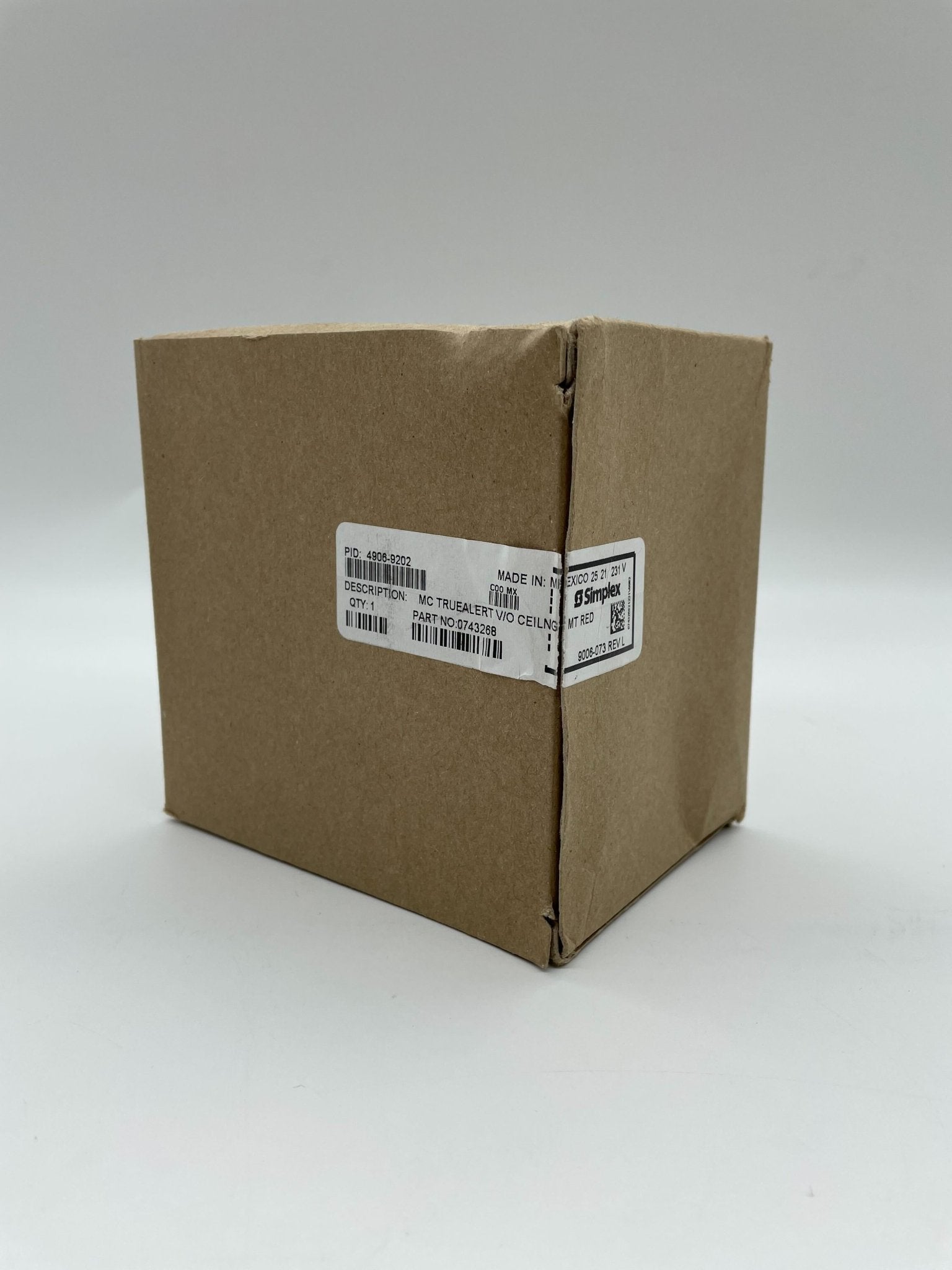 Simplex 4906-9202 strobe light with clear lens and mounting bracket for emergency warning systems.
