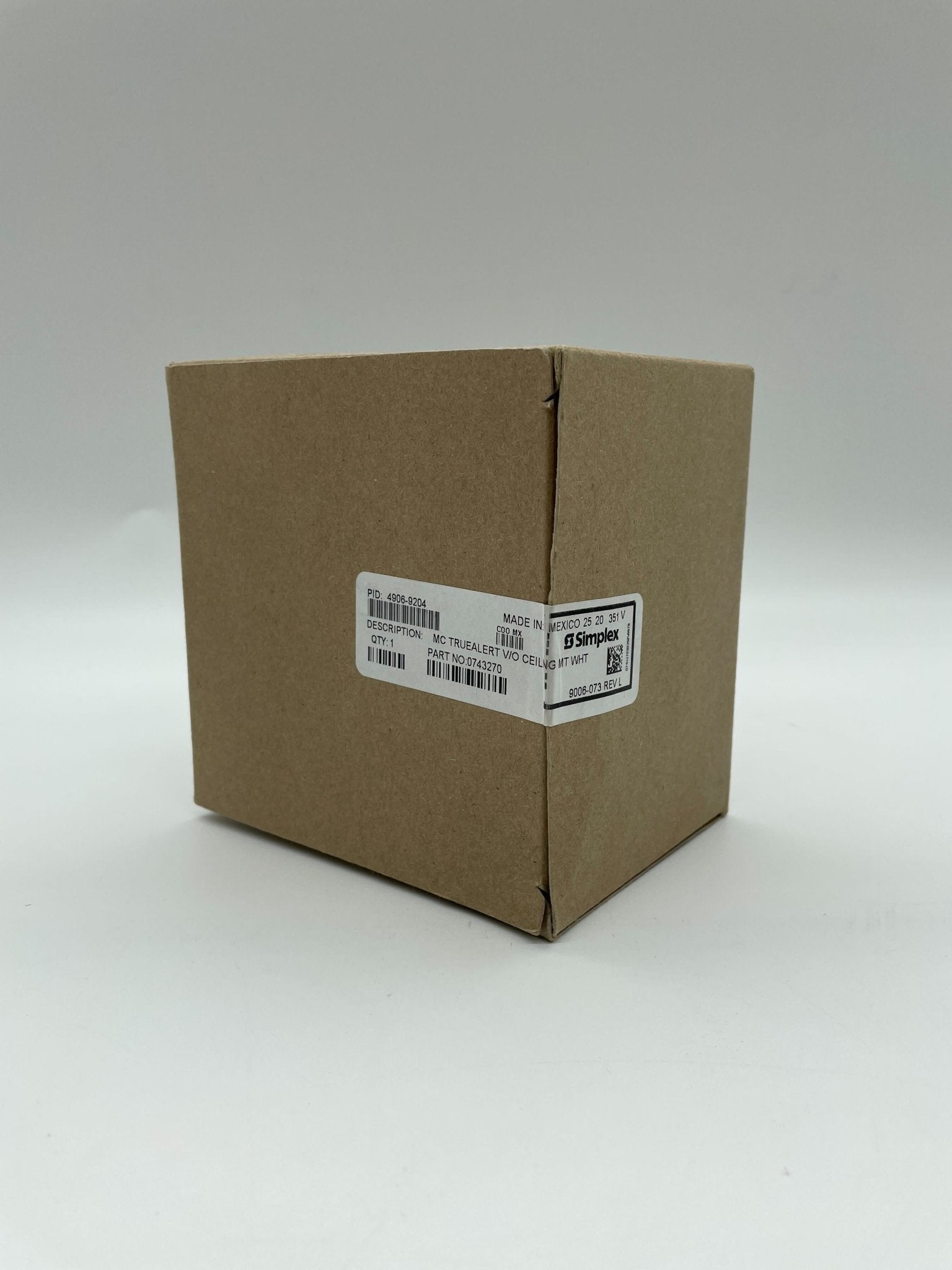 Simplex 4906-9204 strobe light with clear lens and mounting bracket, designed for emergency warning systems.