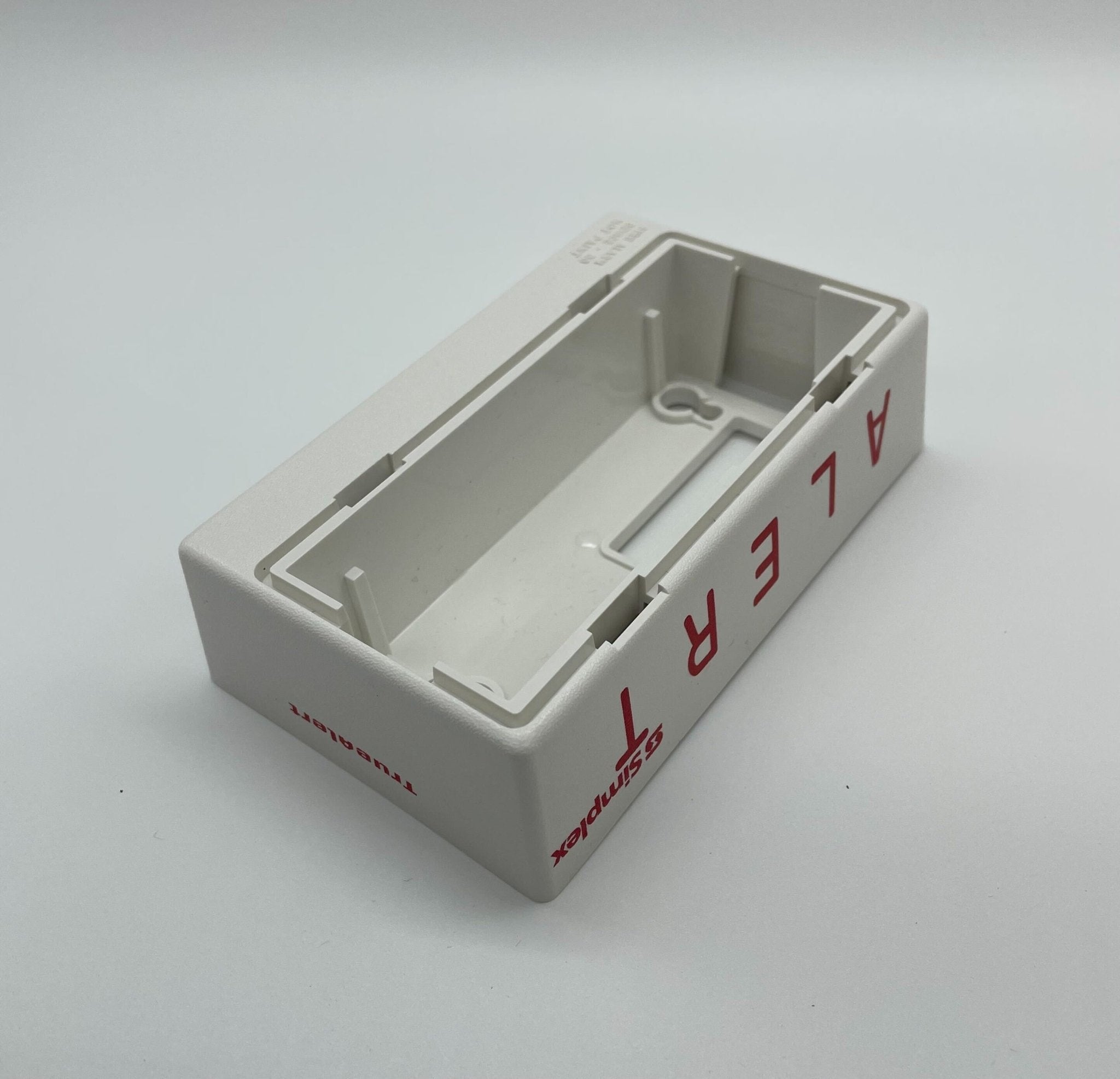 Simplex 4906-9207 fire alarm with white plastic casing and mounting bracket, designed for building fire safety systems