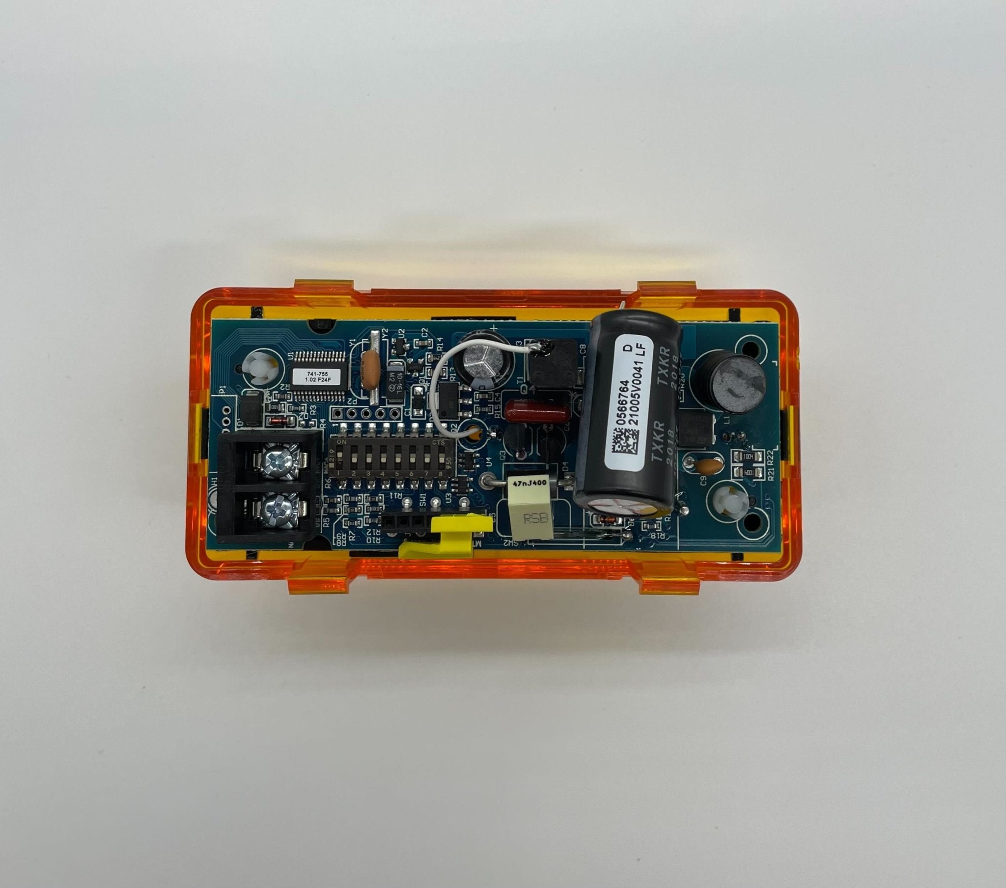 Simplex 4906-9207 fire alarm with white plastic casing, mounted on a wall, designed for building fire safety systems.