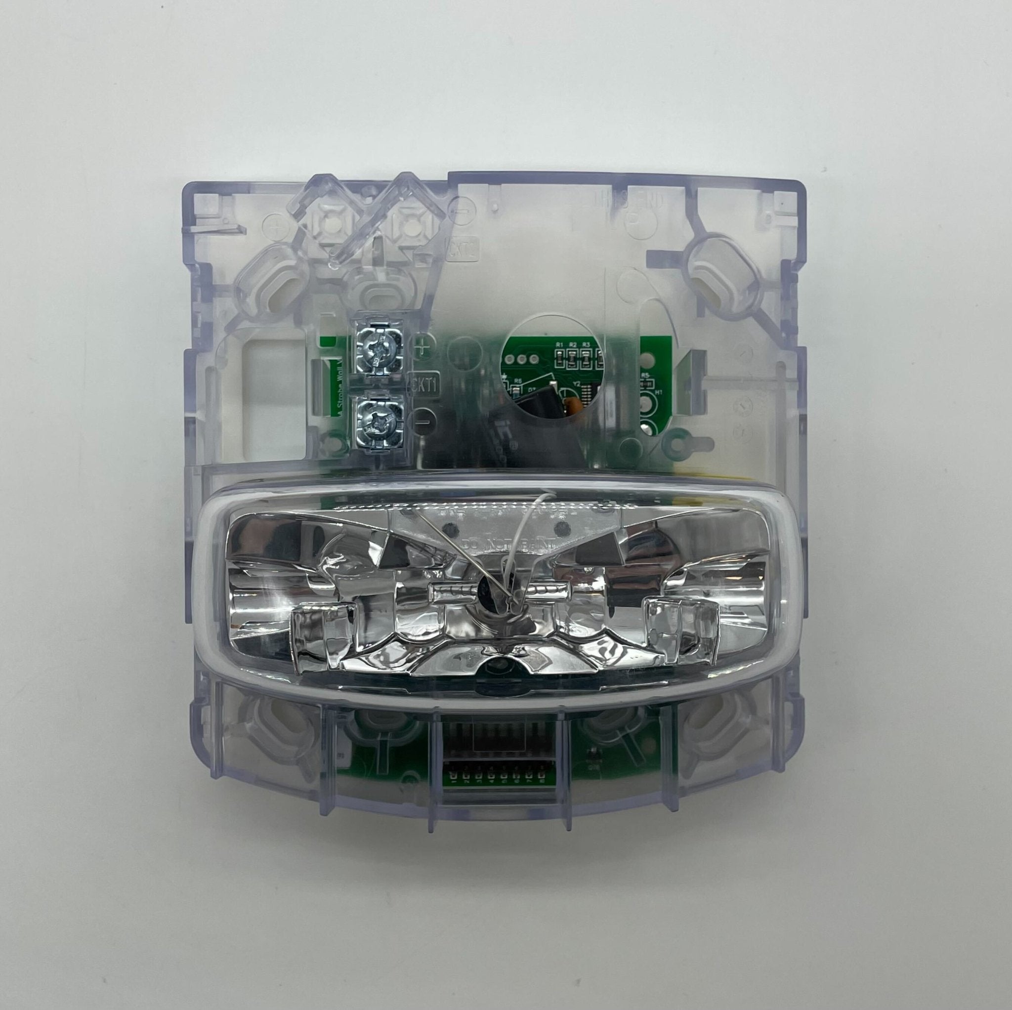 Simplex 4906-9208 fire alarm with white plastic casing and mounting bracket, designed for building safety and fire detection systems.