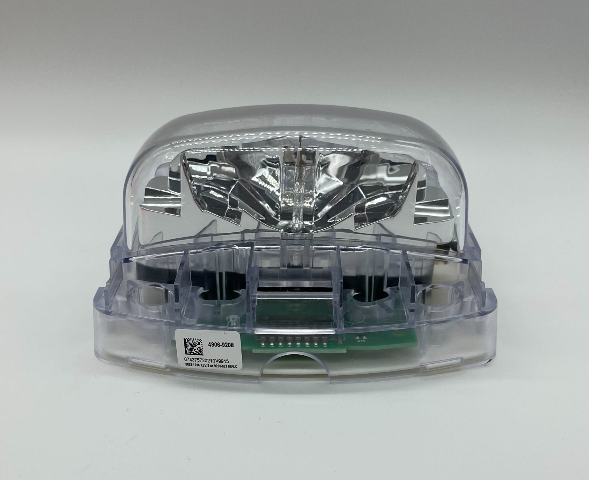 Simplex 4906-9208 fire alarm with white plastic casing and mounting bracket, designed for building safety systems.