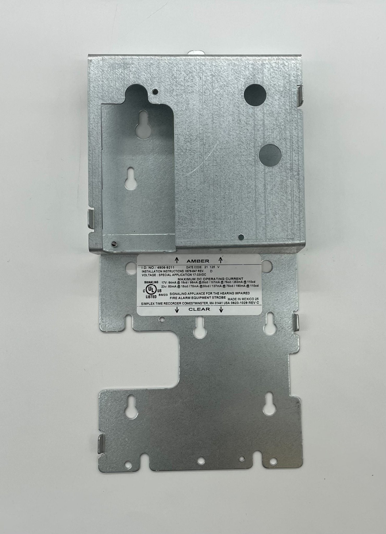Simplex 4906-9211 fire alarm with white plastic casing and mounting bracket, designed for fire safety systems.