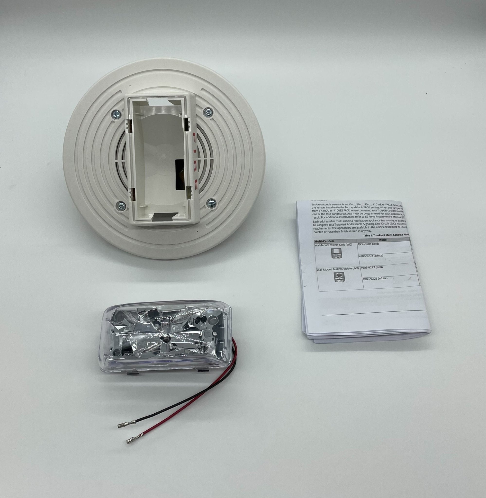 Simplex 4906-9254 speaker strobe alarm with red housing and mounting bracket, used for fire safety alerts.