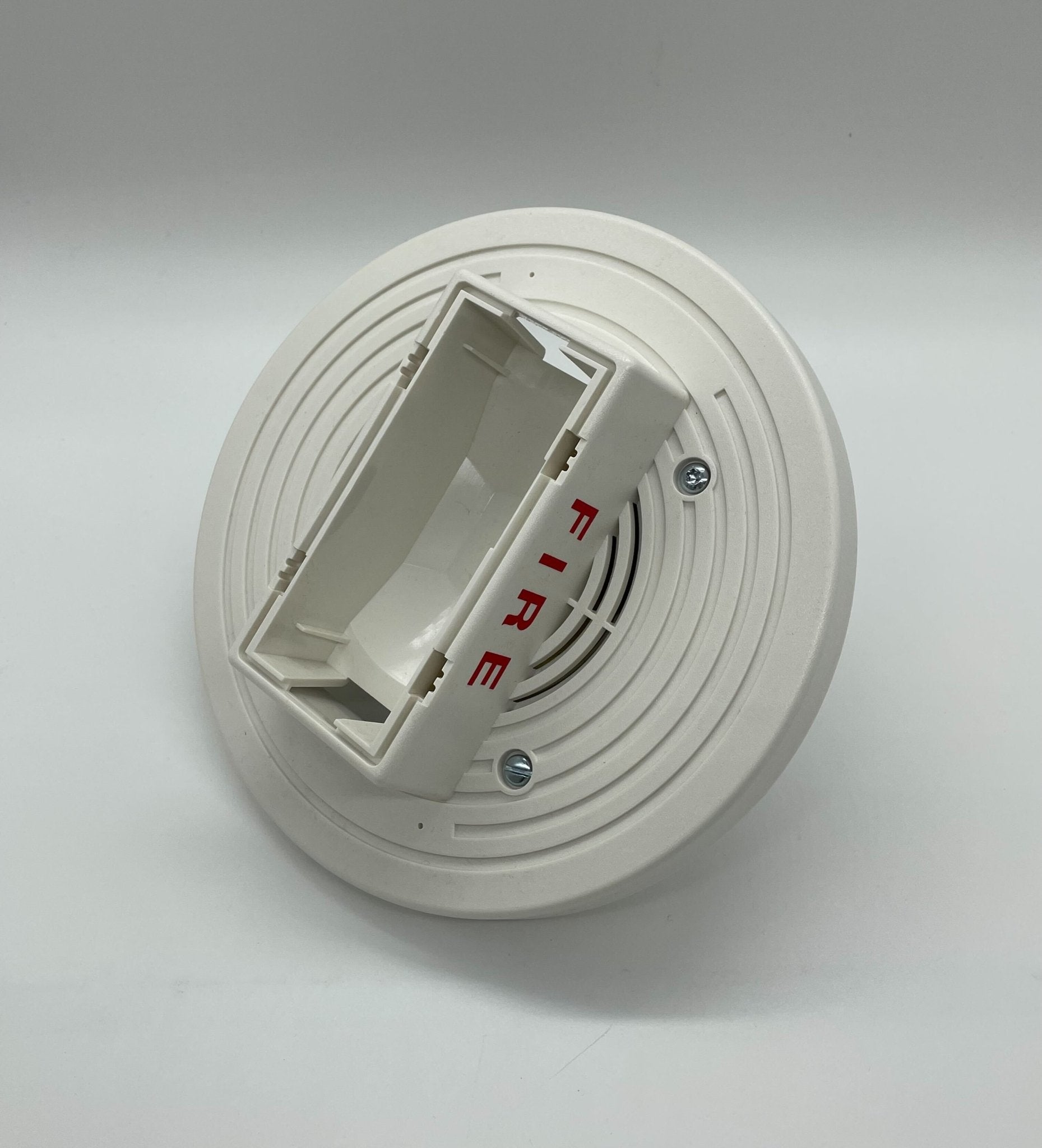 Simplex 4906-9254 speaker strobe light mounted on a ceiling, white device with alert lens, for fire alarm notification.