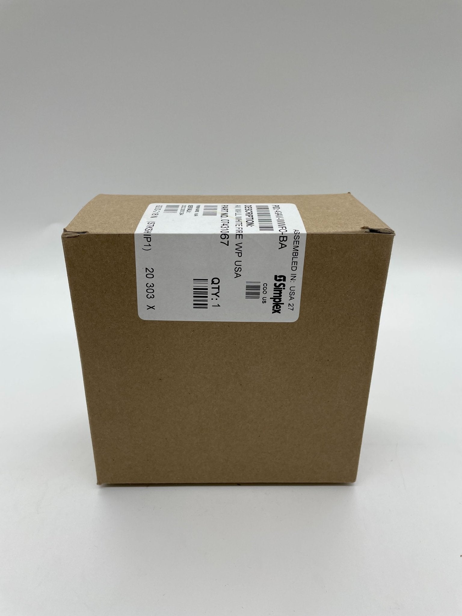 Simplex 49AV-WWFO-BA fire alarm with white cover and control unit, designed for building safety and emergency alert systems