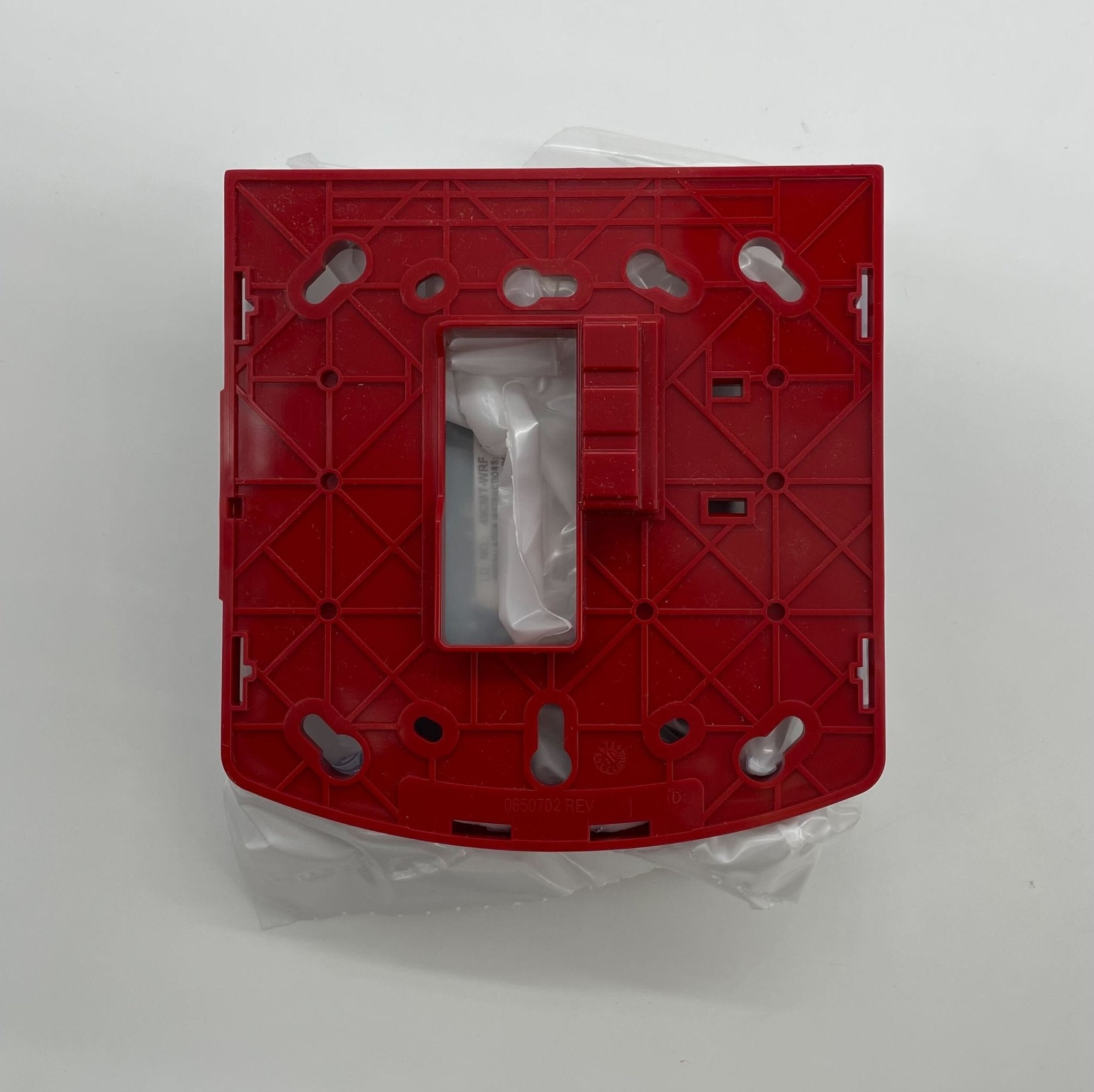 Simplex 49CMT-WRF fire alarm with wireless remote station, mounted on wall, in a safety equipment setup.