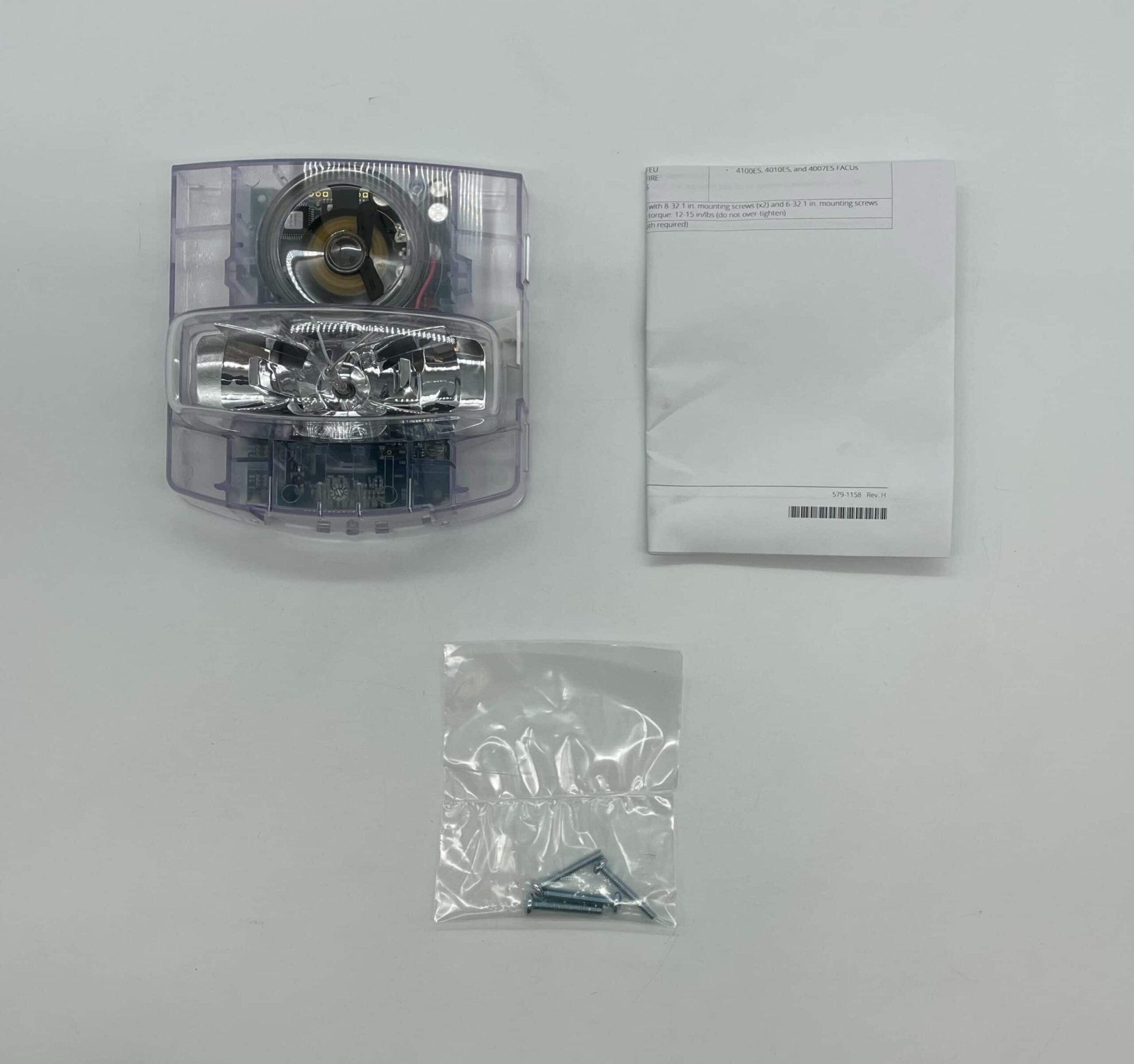 Simplex 49CMTV-APPLW strobe light with red lens, mounted on a wall, designed for emergency signaling and safety alerts.