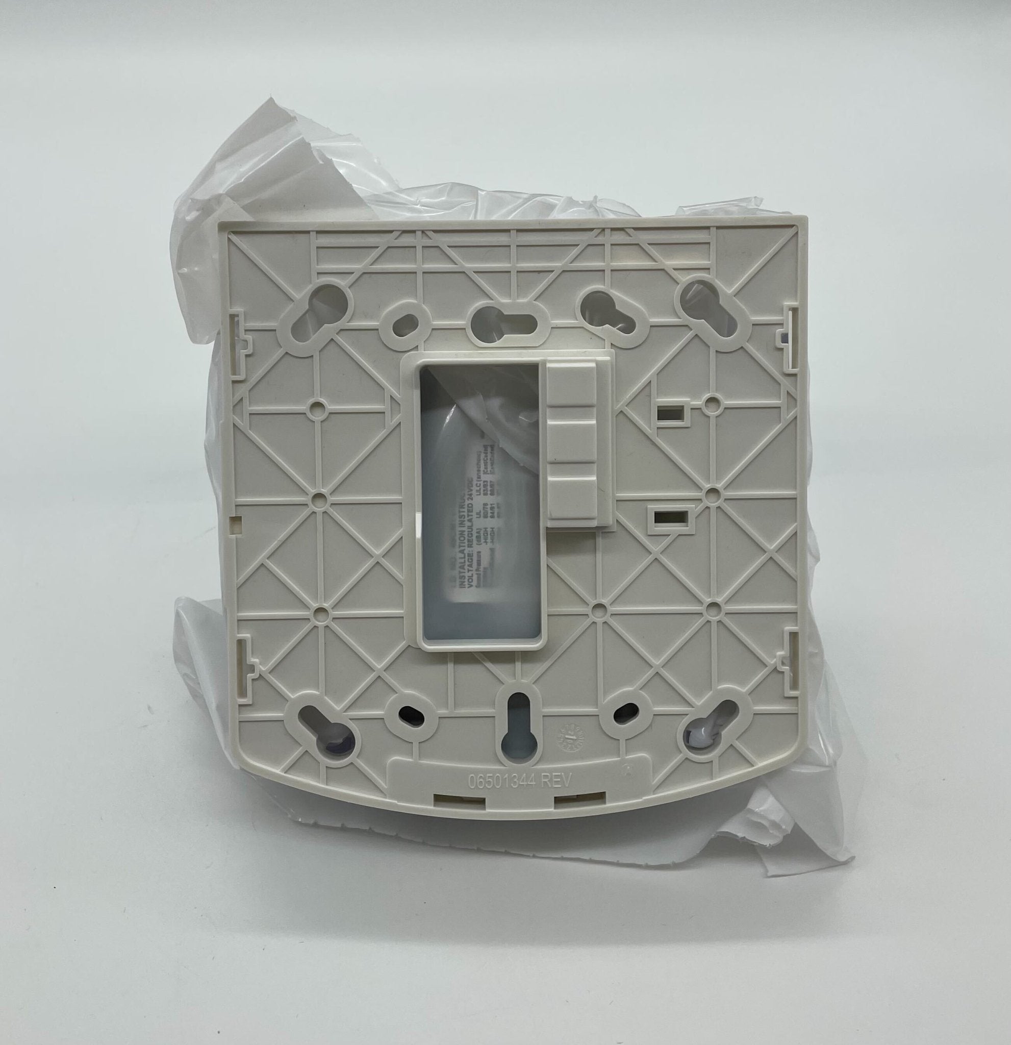 Simplex 49CMTV-WWF horn strobe alarm device with clear lens and mounting bracket, designed for emergency alert systems.