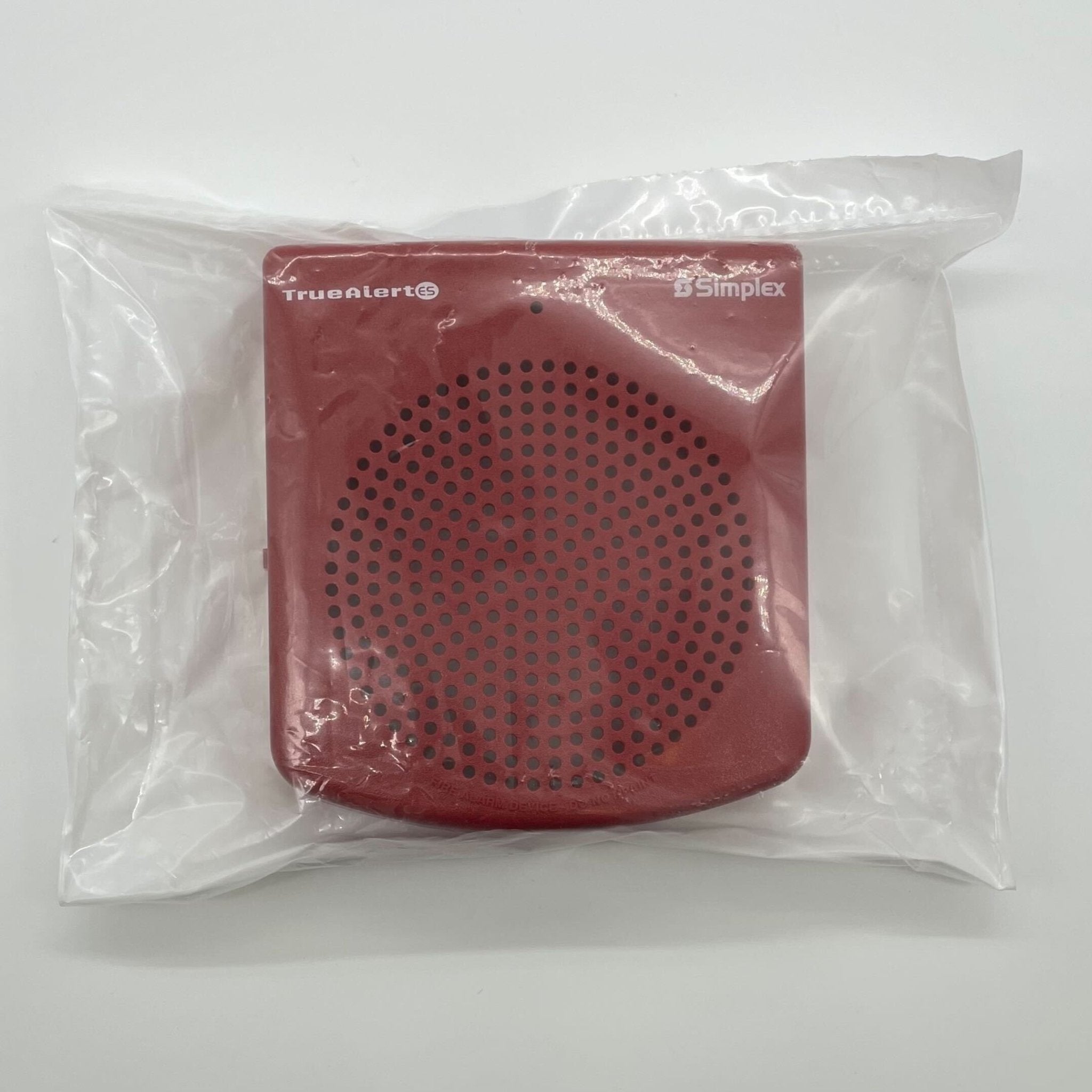 Simplex 49SOC-WRFIRE cover by Simplex, designed for fire alarm systems, shown in an outdoor setting.