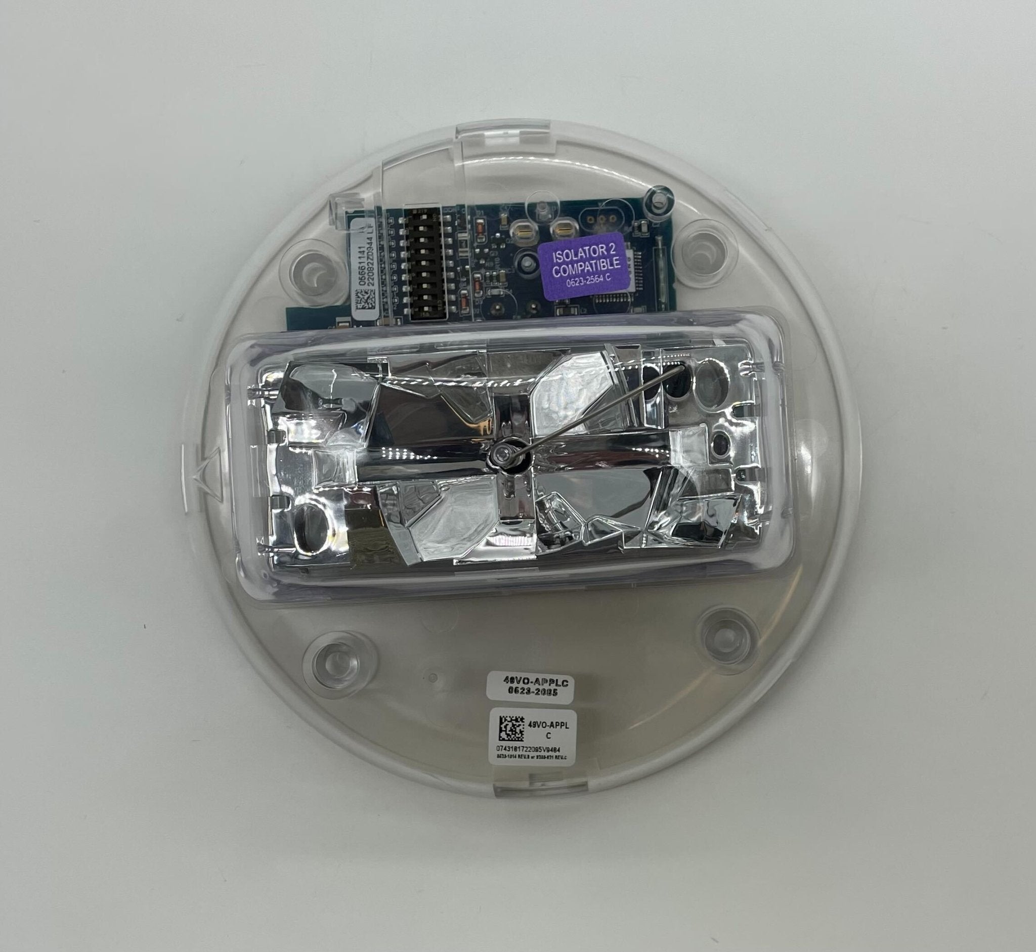 Simplex 49VO-APPLC strobe light mounted on a wall, featuring clear lens and compact design by Simplex for emergency signaling.