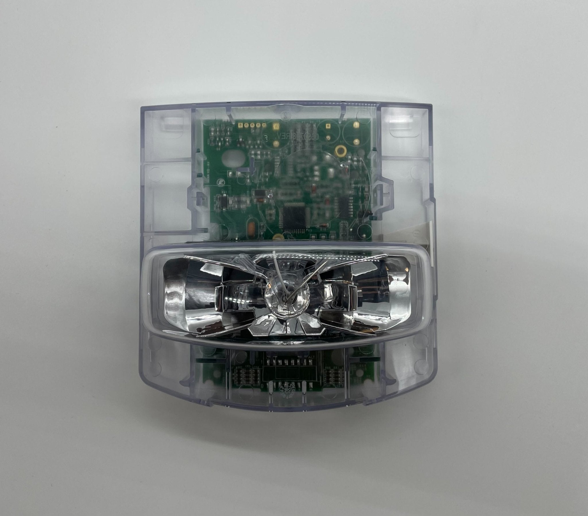 Simplex 49VO-APPLWE strobe light with orange lens, mounted on a wall, for visual signaling or alarm systems.