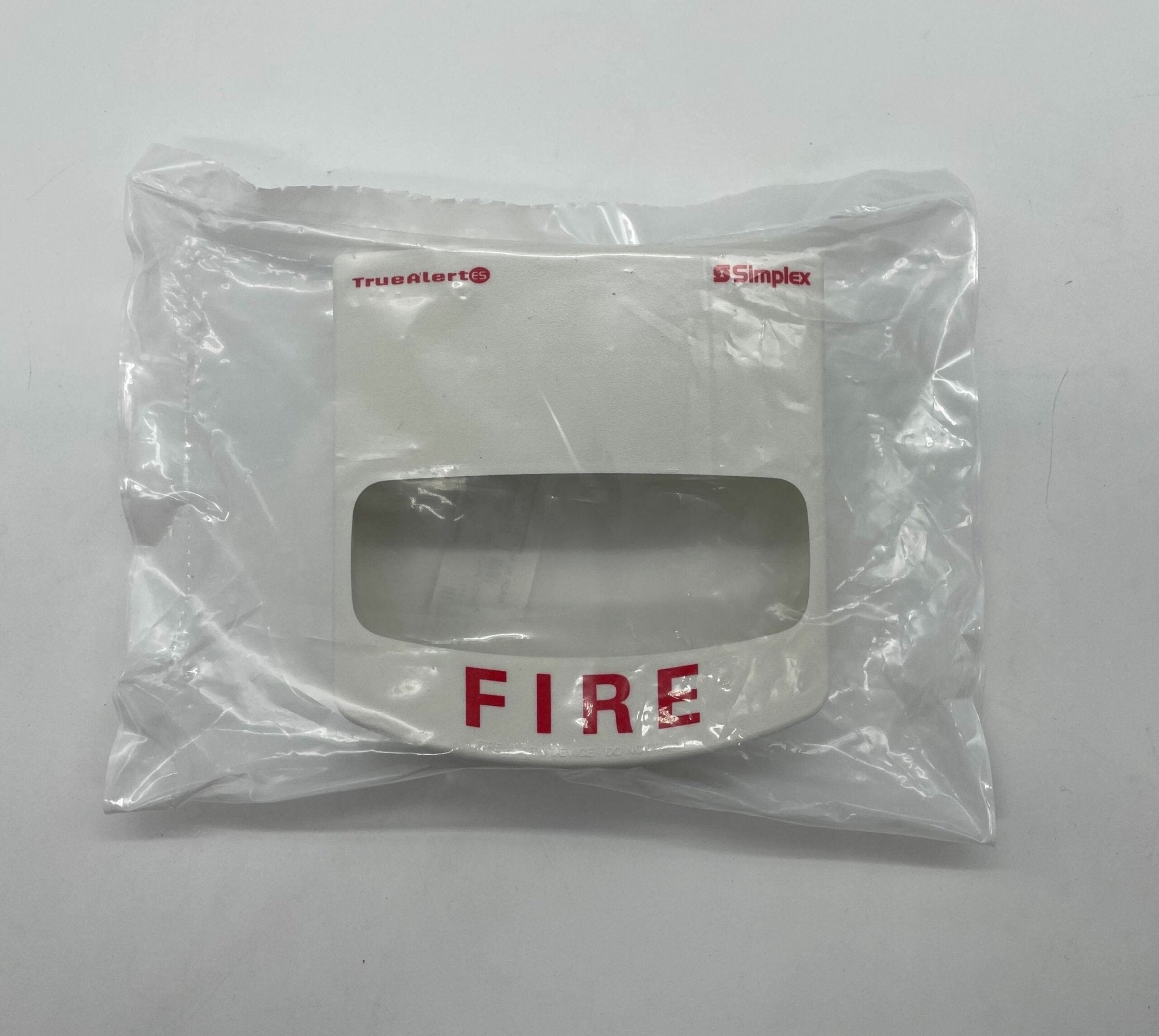 Simplex 49VOC-WWFIRE cover, fire-resistant protective cover by Simplex, shown in a natural outdoor setting.