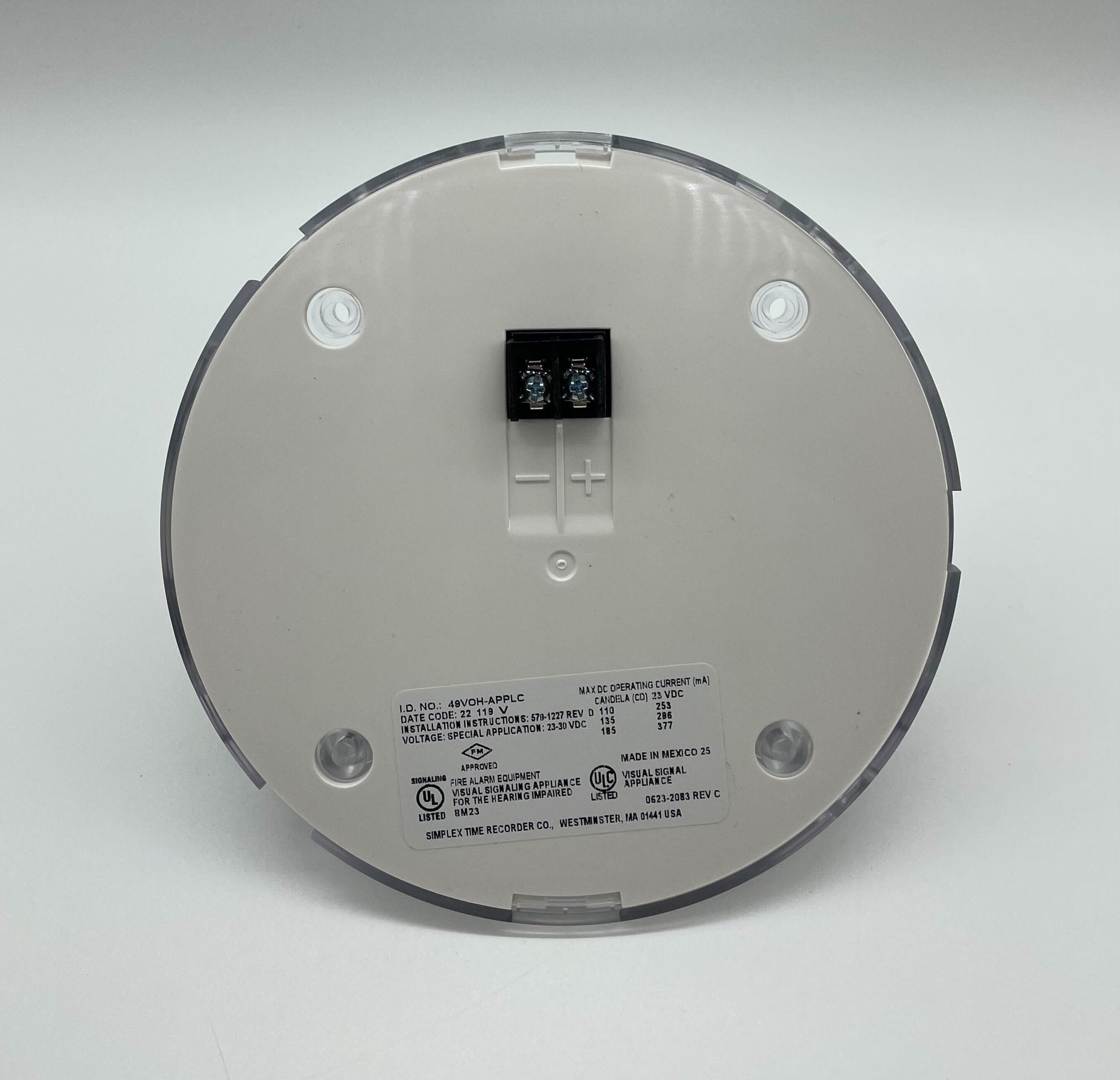 Simplex 49VOH-APPLC strobe light with orange cover, mounted on a ceiling, used for alarm and warning signals.
