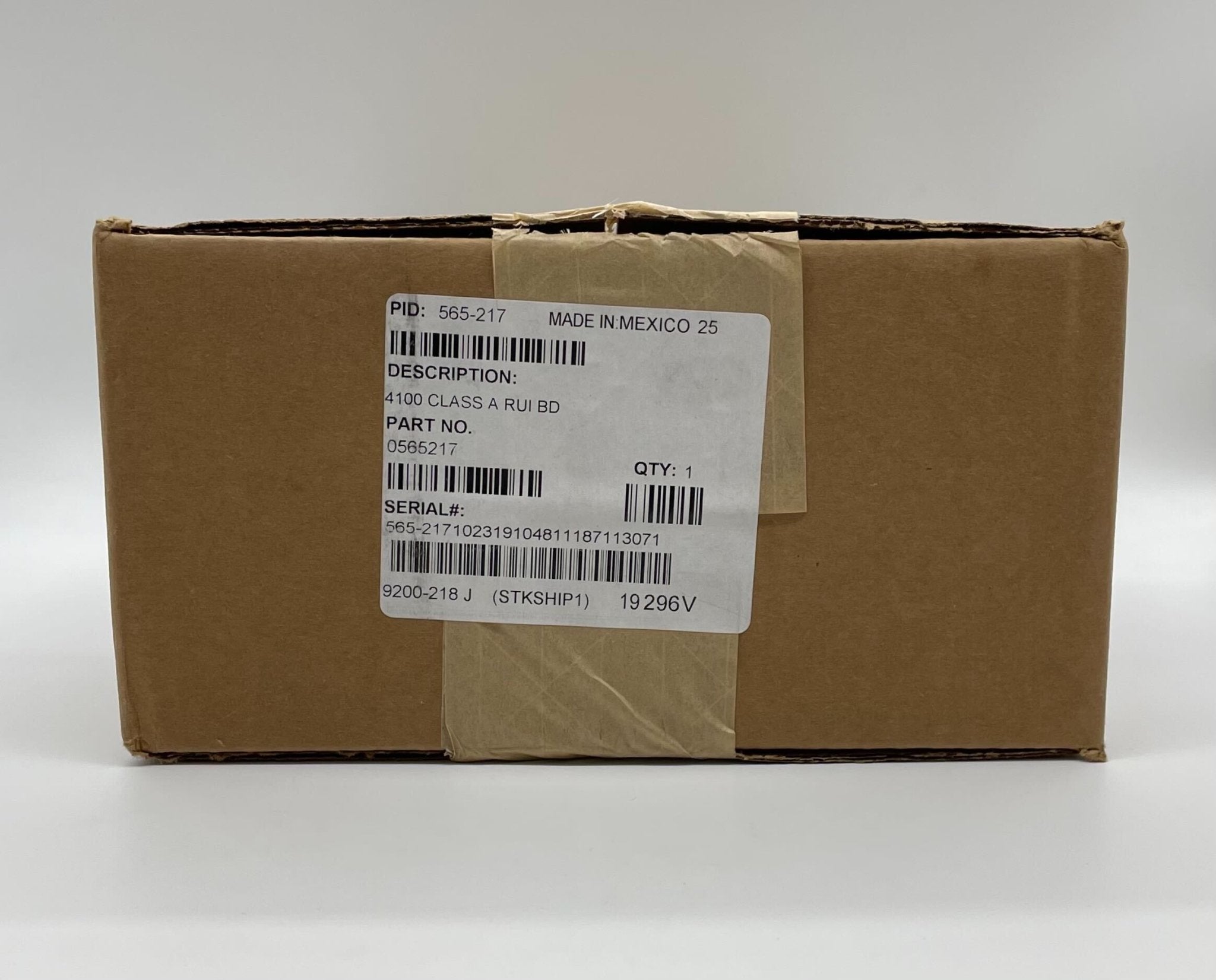 Simplex 565-217 fire alarm device with white plastic casing, designed for building safety and fire detection.