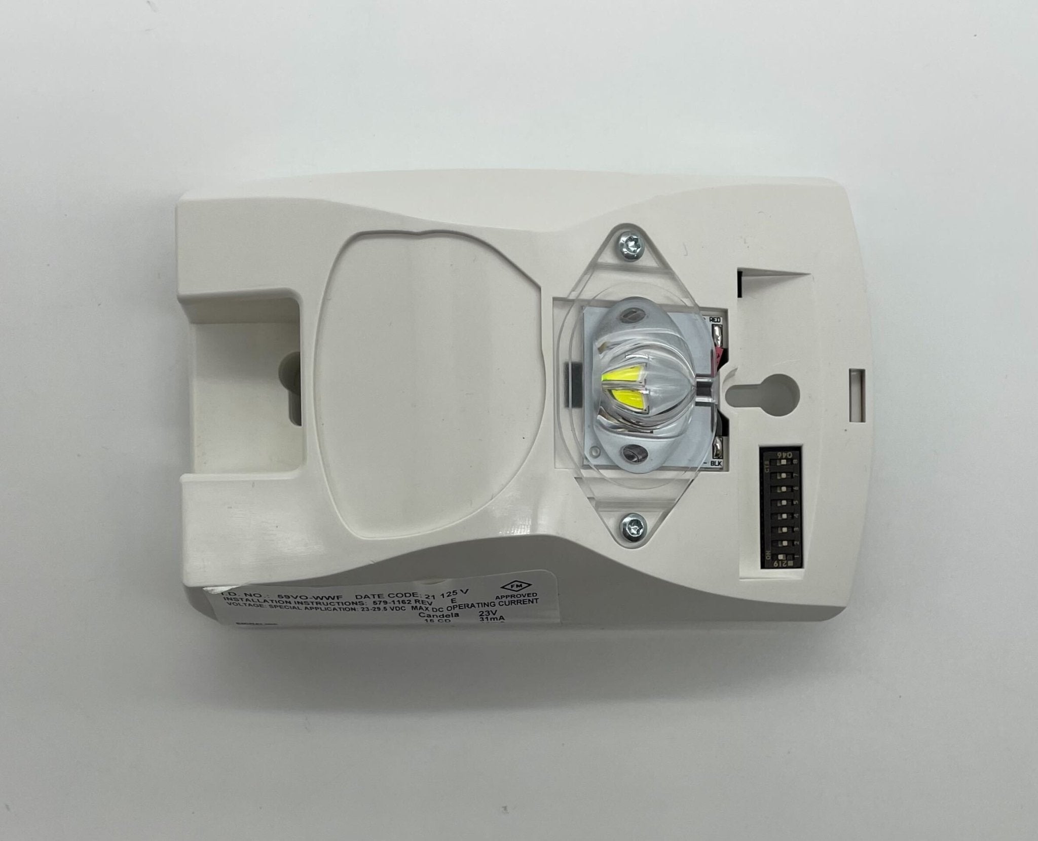 Simplex 59VO-WWF fire alarm unit from Simplex, featuring a white alarm with indicator lights and mounting bracket.