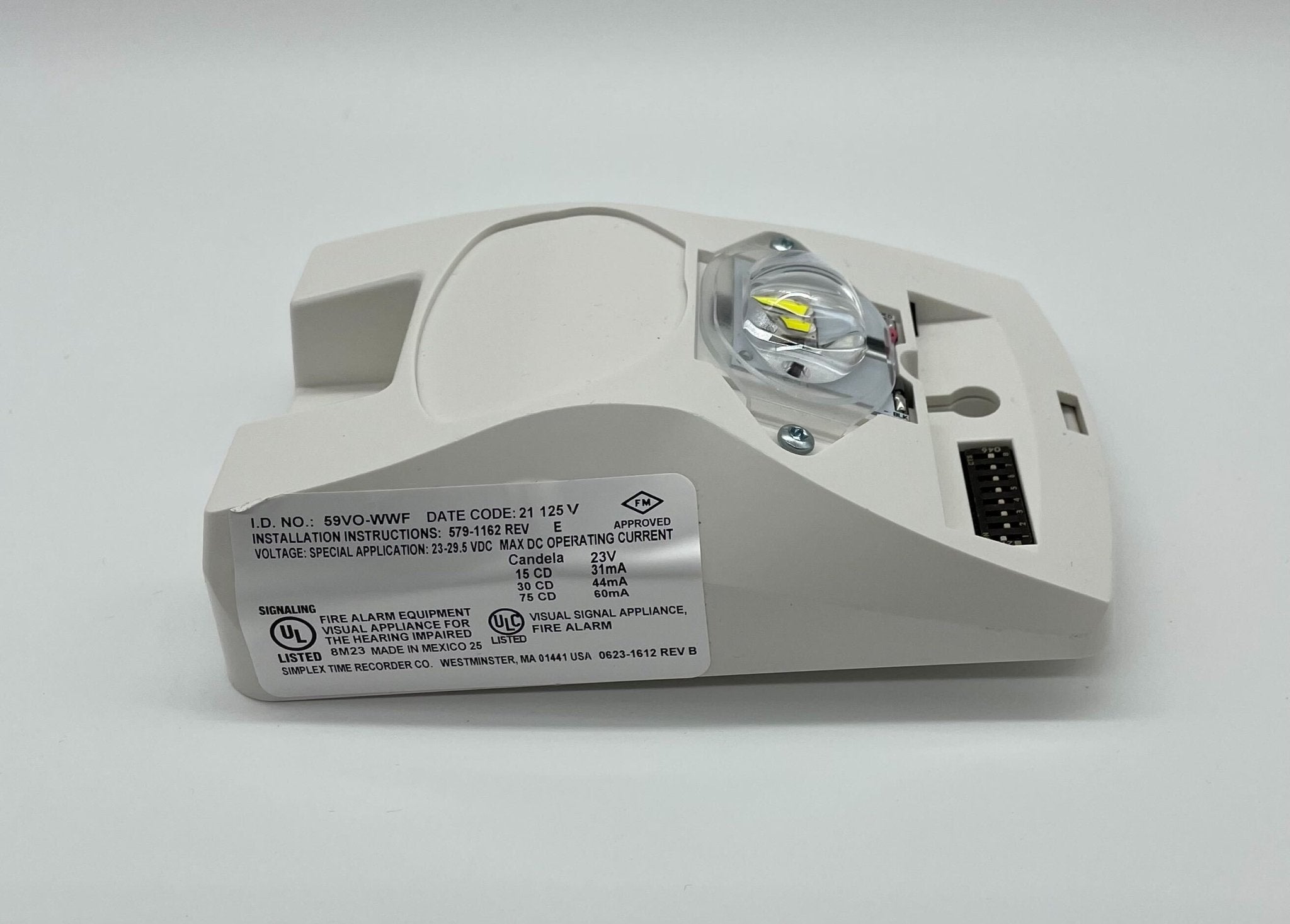 Simplex 59VO-WWF fire alarm with visual indicator, mounted on wall, showcasing its compact design and control features.