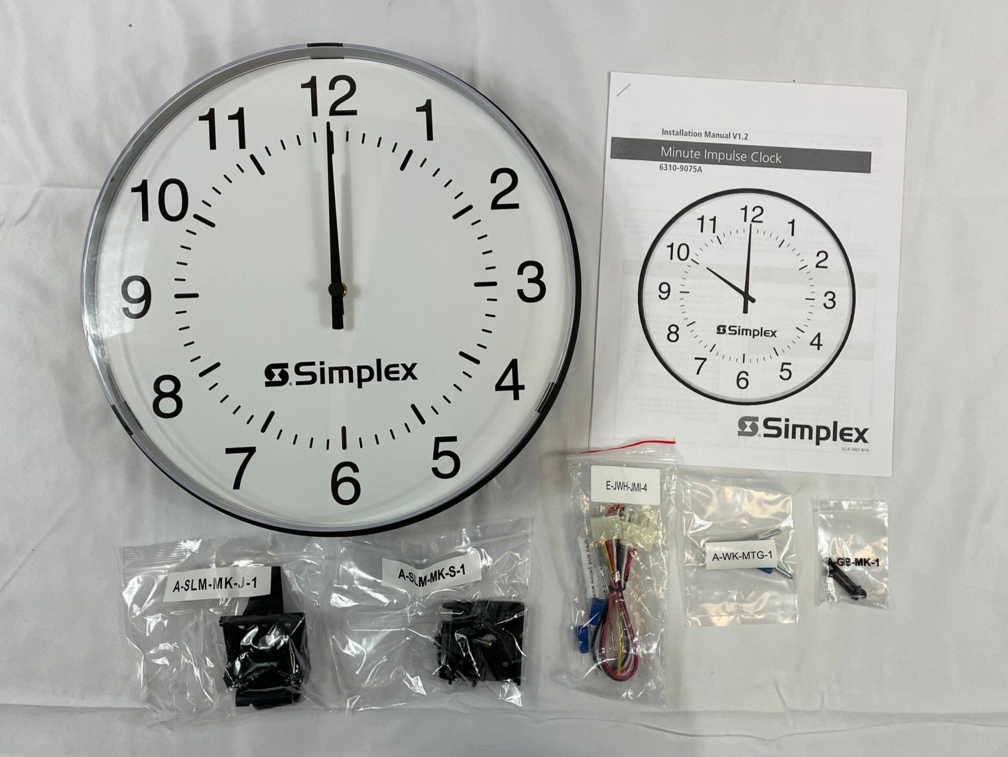 Simplex 6310-9075A fire alarm device with a white plastic enclosure, designed for fire safety and alarm systems.