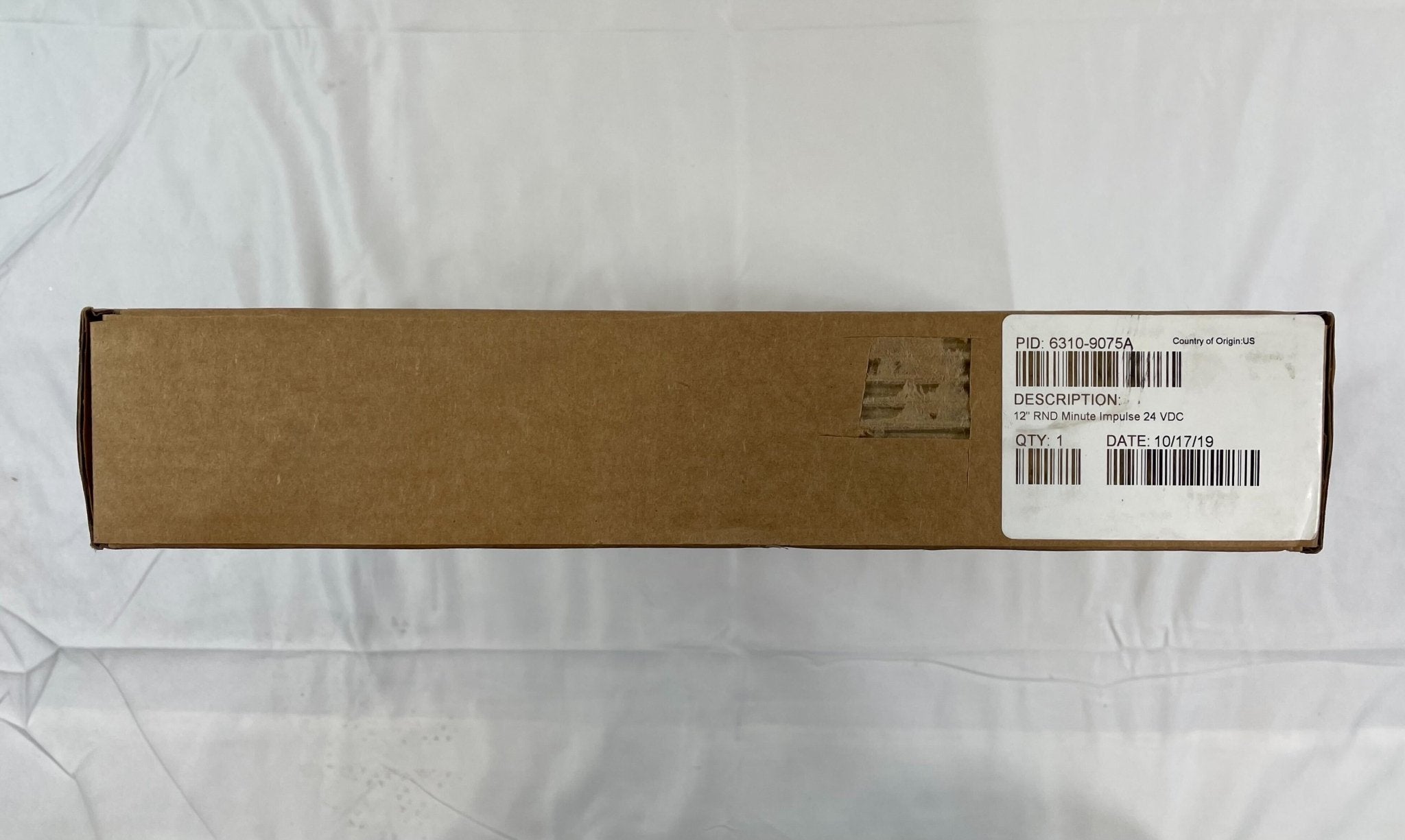 Simplex 6310-9075A fire alarm with a white rectangular detector and mounting hardware, designed for building safety.