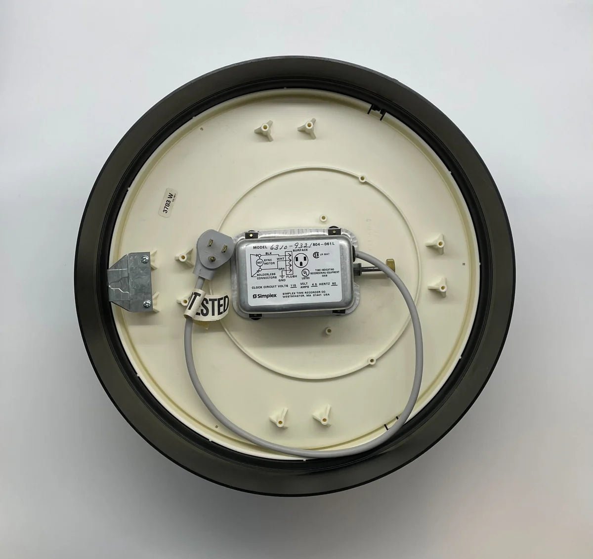 Simplex 6310-9321 fire alarm with digital display and mounting bracket, designed for building safety and fire detection.