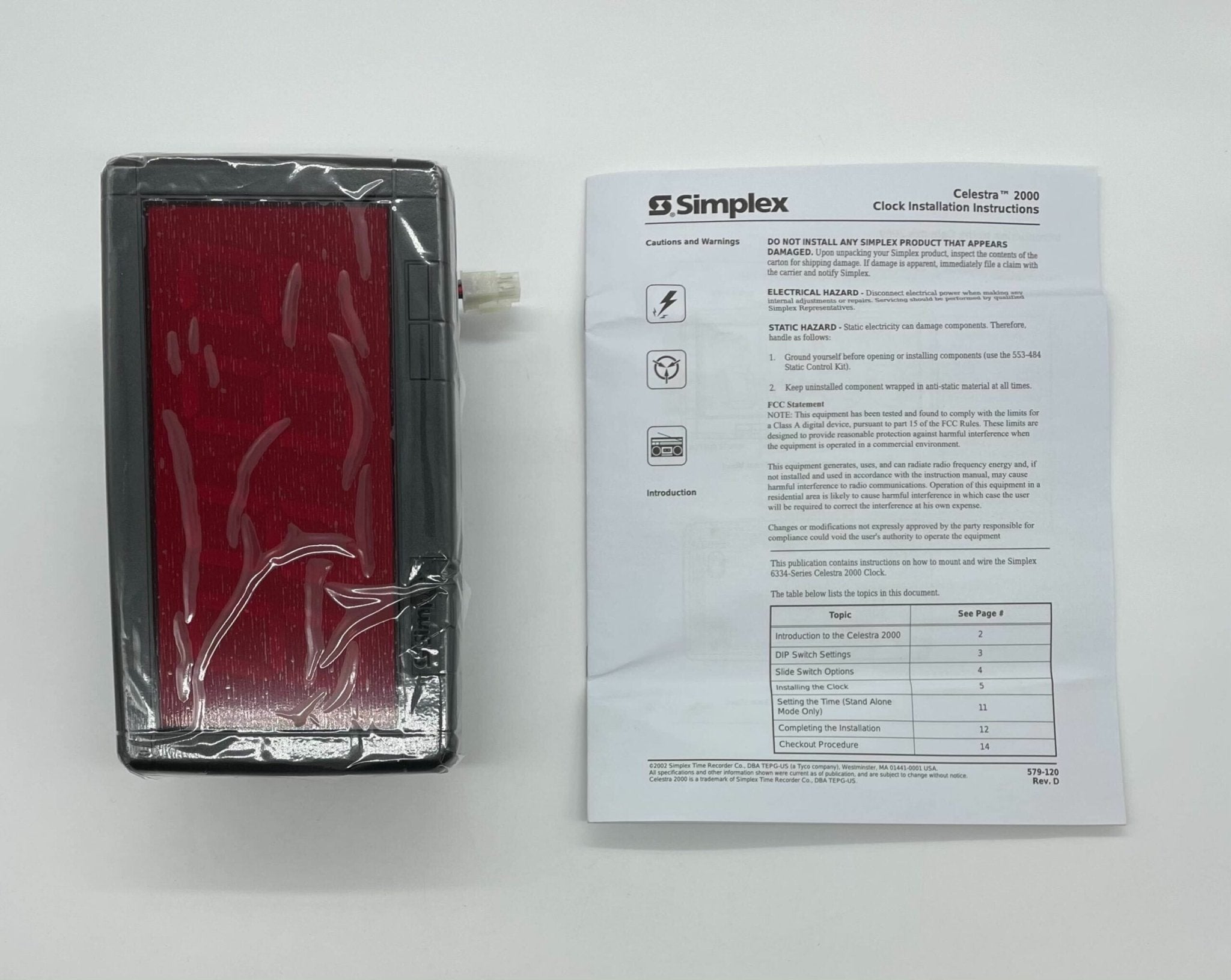 Simplex 6334-9125 fire alarm with white plastic housing and mounting bracket, designed for building safety systems.