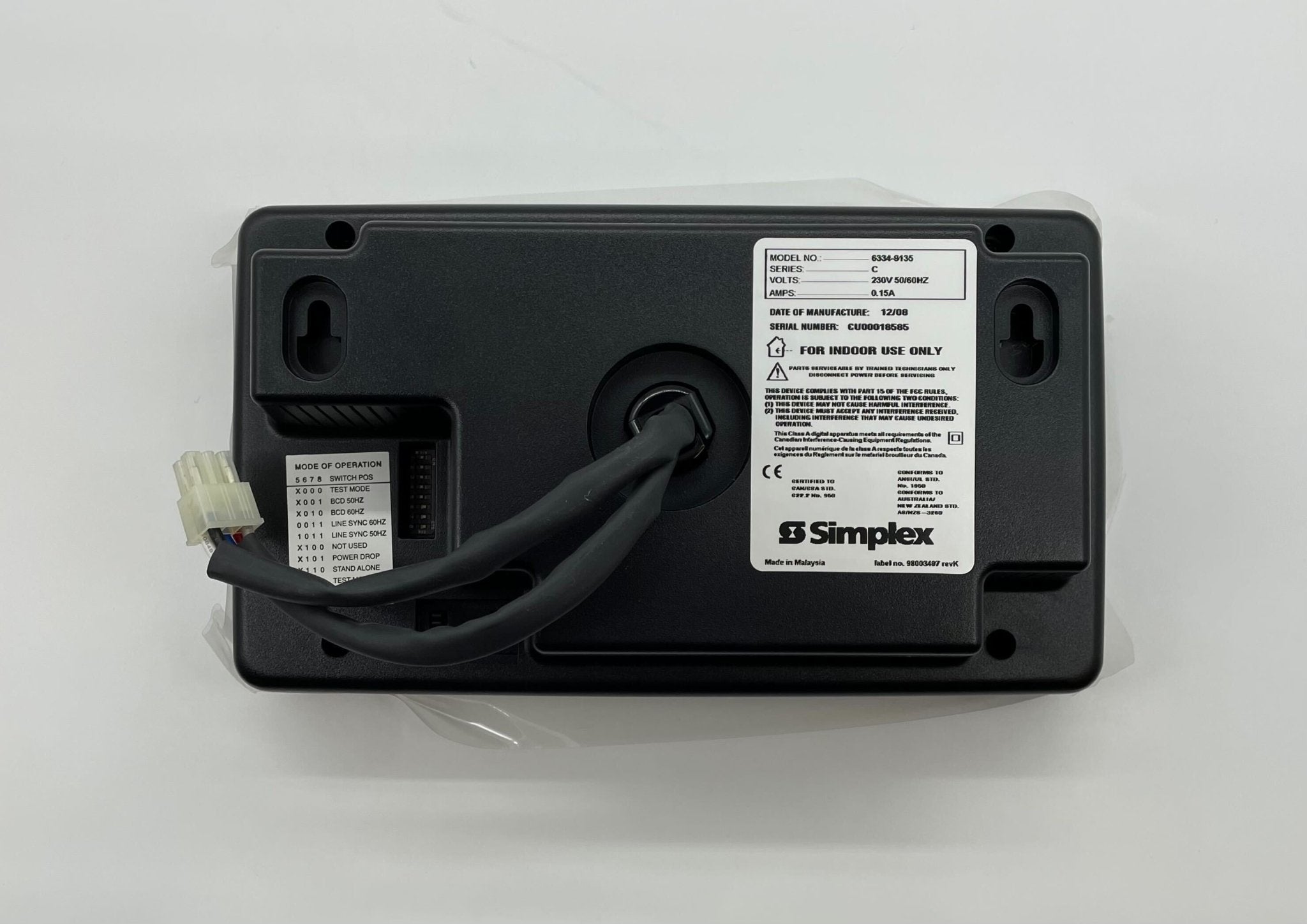 Simplex 6334-9135 fire alarm with white casing and mounting bracket, designed for building safety and fire detection systems.