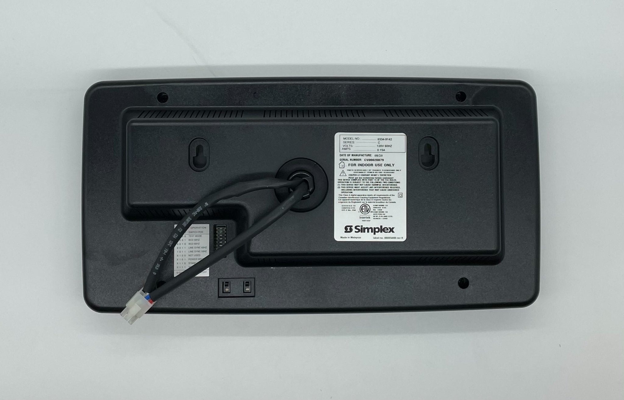 Simplex 6334-9142 fire alarm device with white plastic housing and mounting bracket, designed for fire safety systems.
