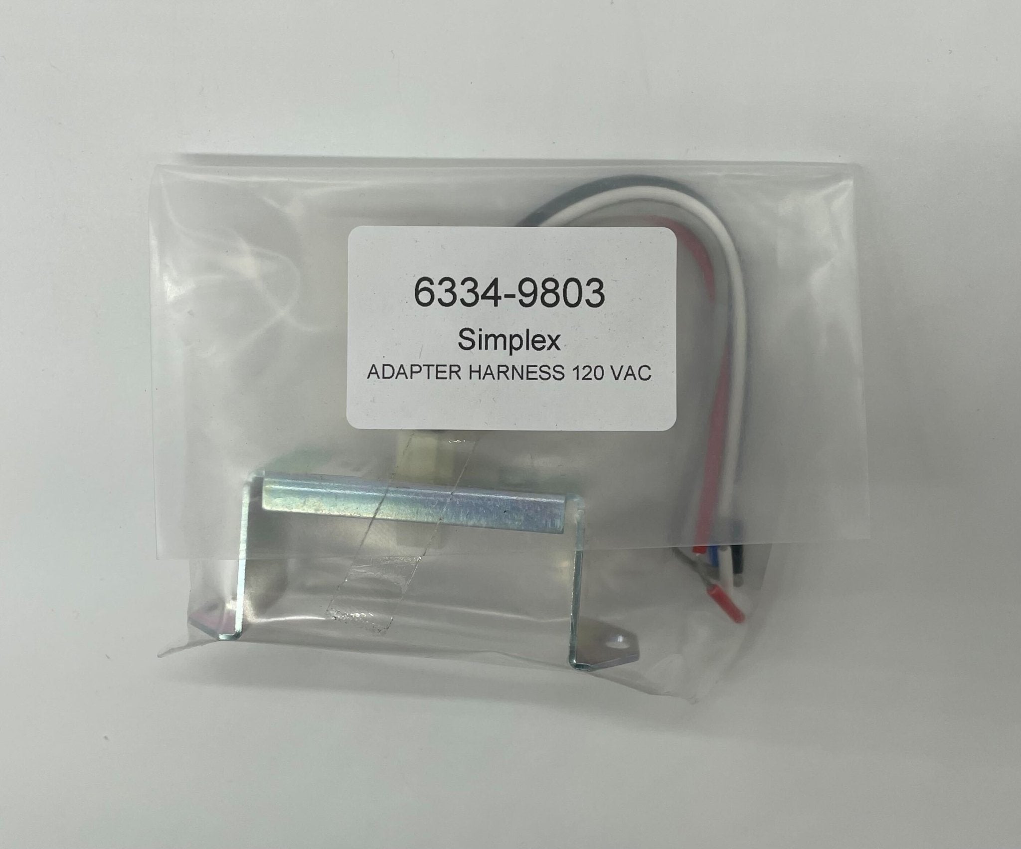 Simplex 6334-9803 fire alarm with white plastic casing and mounting bracket, designed for fire safety systems.