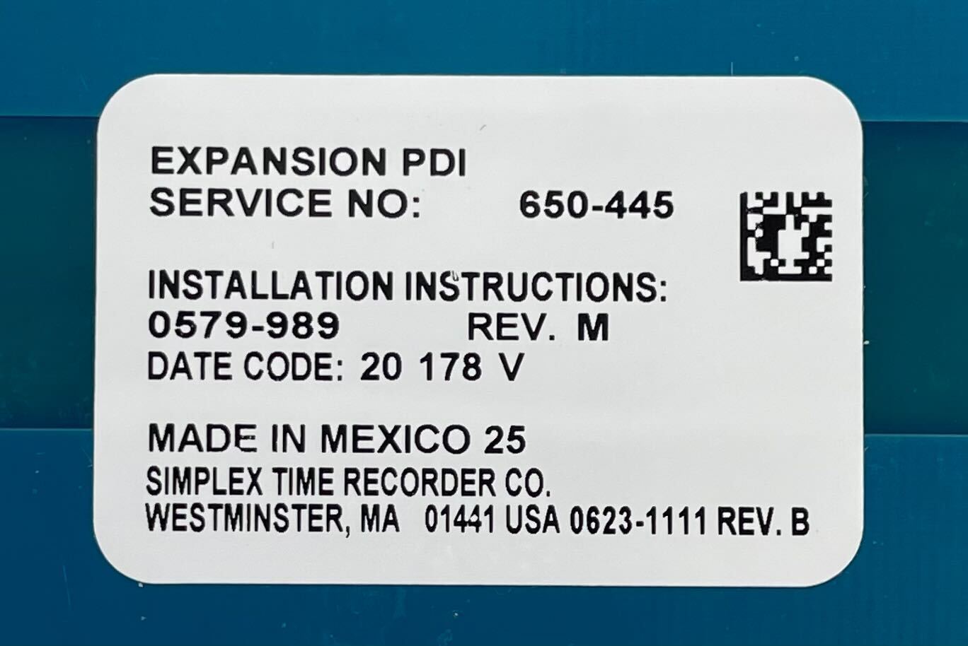 Simplex 650-445 fire alarm device installed on a ceiling, part of Simplex fire alarm systems for safety and fire detection.