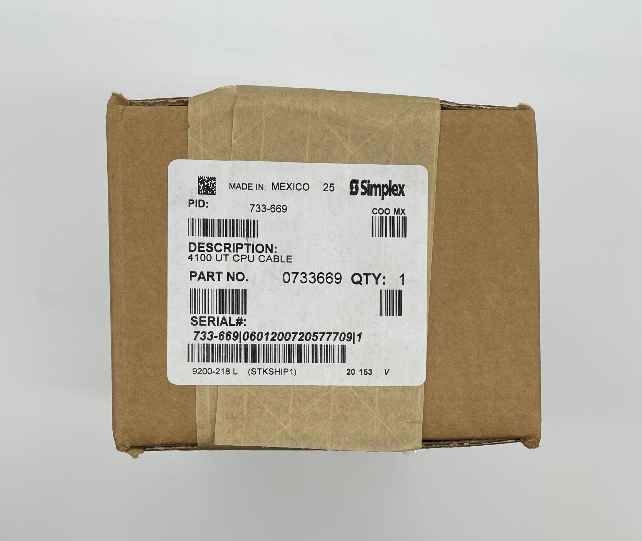 Simplex 733-669 fire alarm system with alarm sensor and wiring, designed for fire safety and detection.