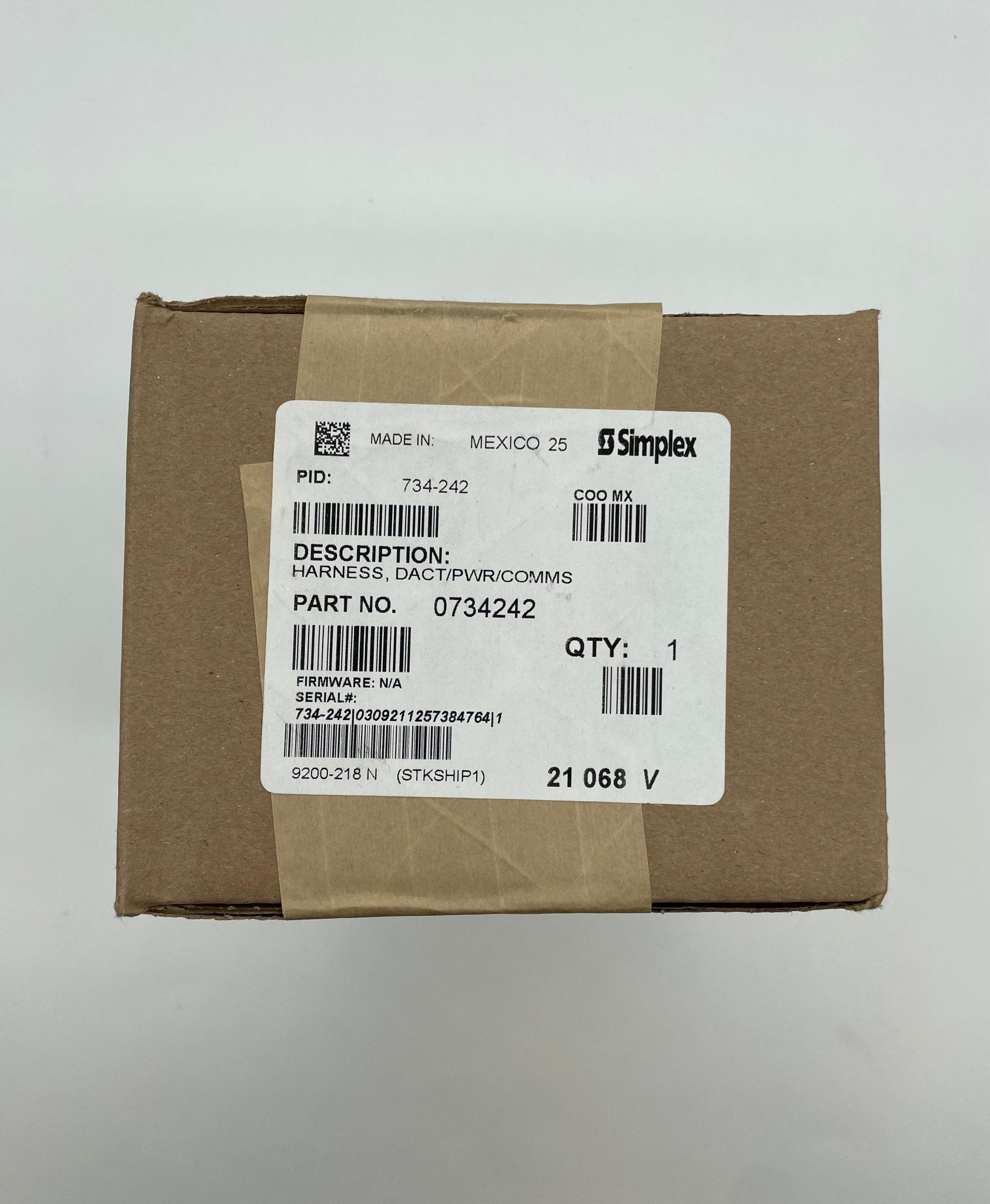 Simplex 734-242 fire alarm with digital display and sensor, mounted on a wall, in a commercial setting.