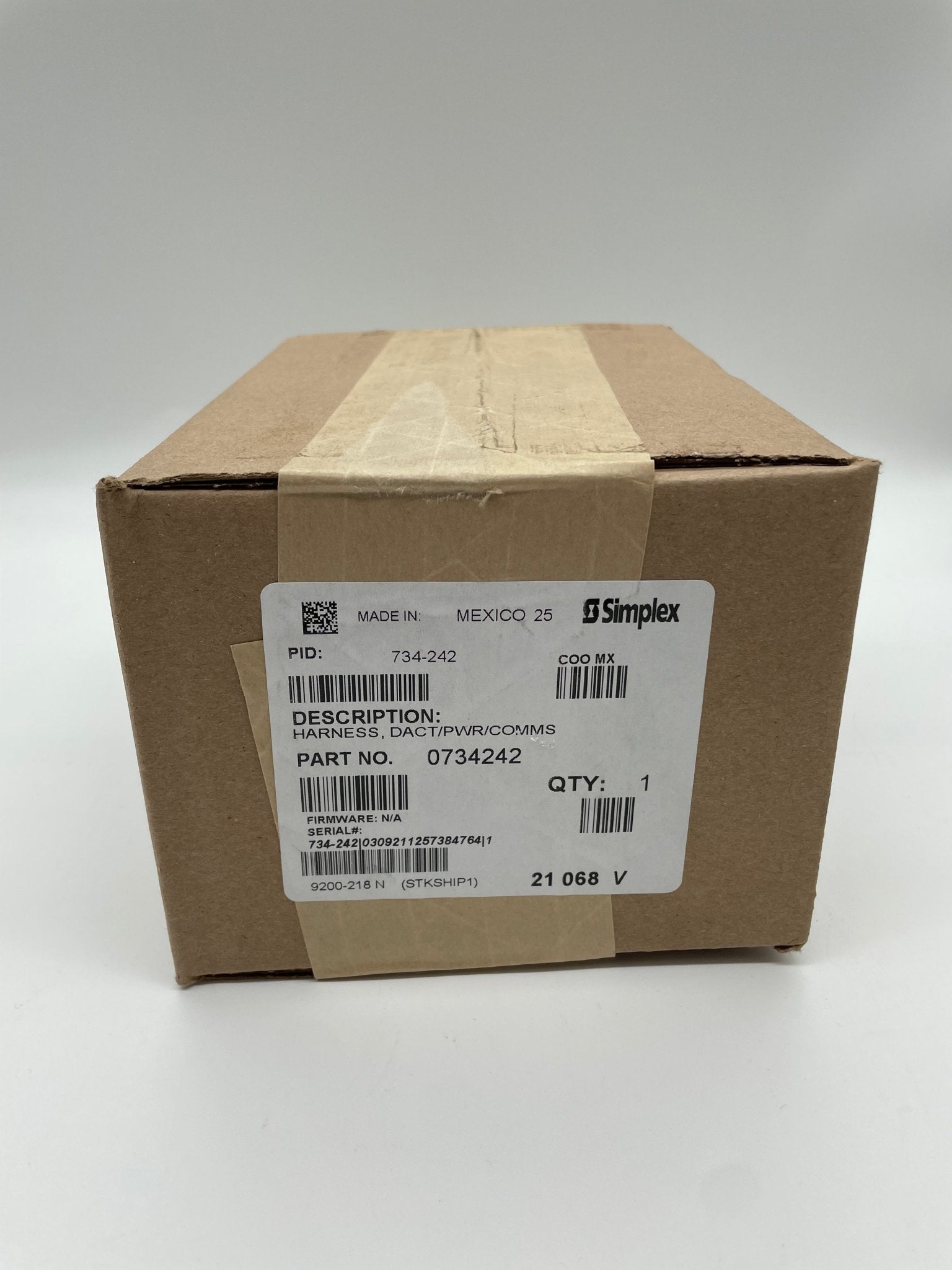 Simplex 734-242 fire alarm device installed on a ceiling, part of Simplex fire alarm system for safety and alerting.