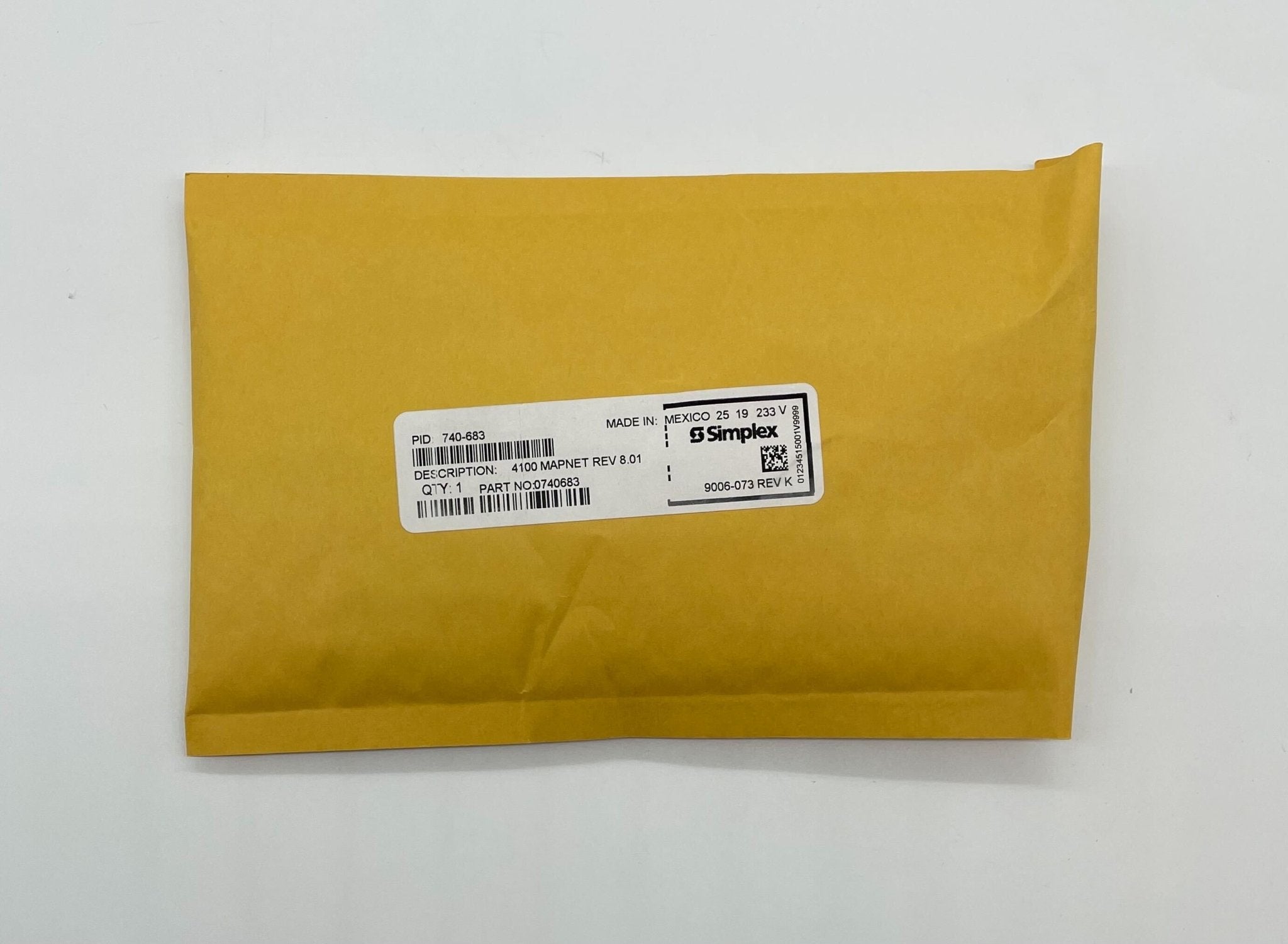 Simplex 740-683 fire alarm with a white plastic cover and mounting bracket, designed for building safety systems.