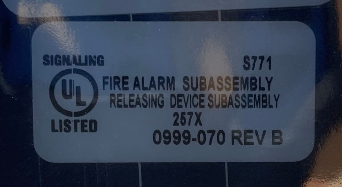 Simplex 742-101 fire alarm device mounted on wall, part of Simplex fire alarm system for safety and detection.