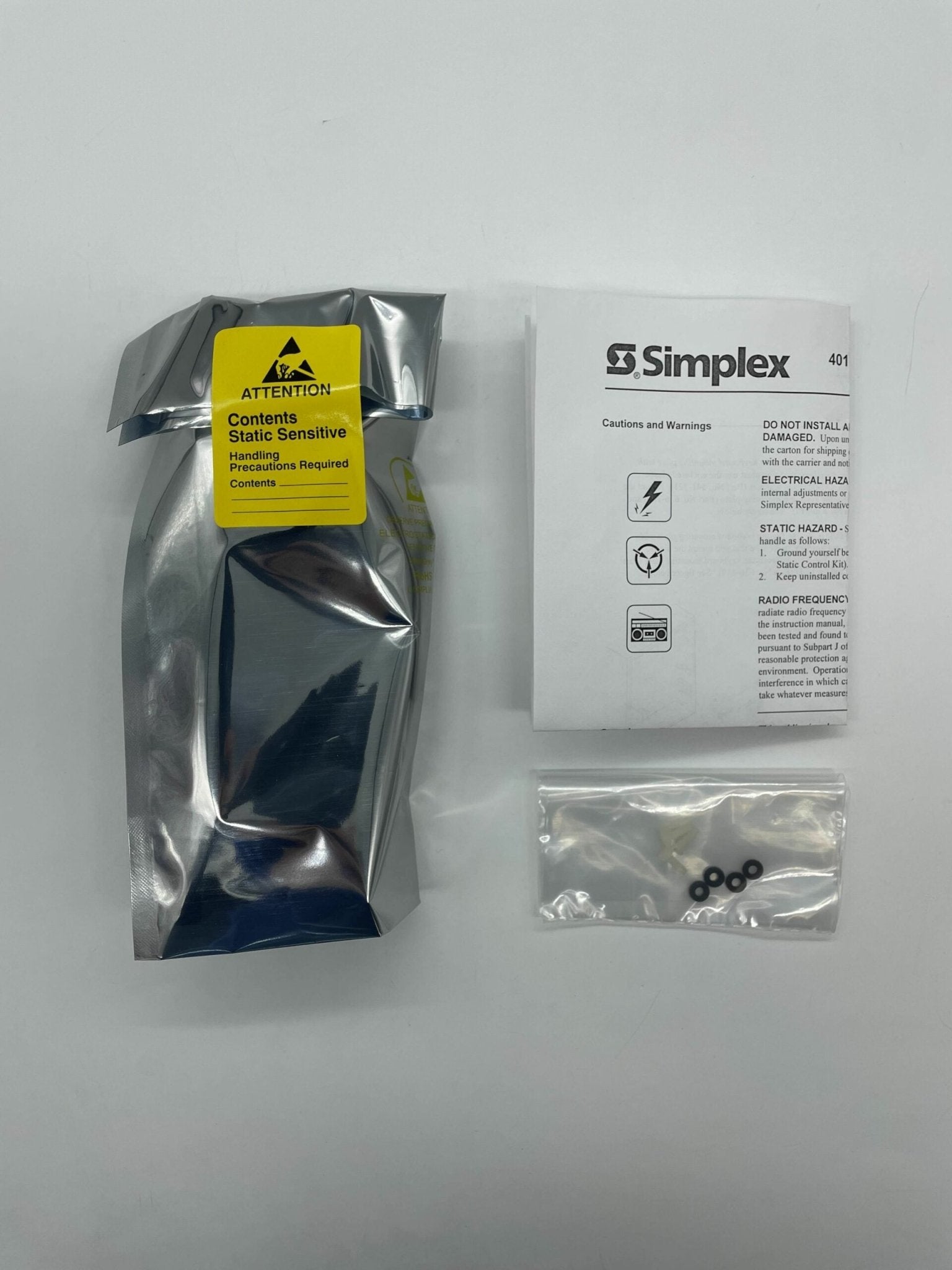 Simplex 743-180 fire alarm with red alarm bell and white mounting base, designed for fire safety and emergency alert systems.