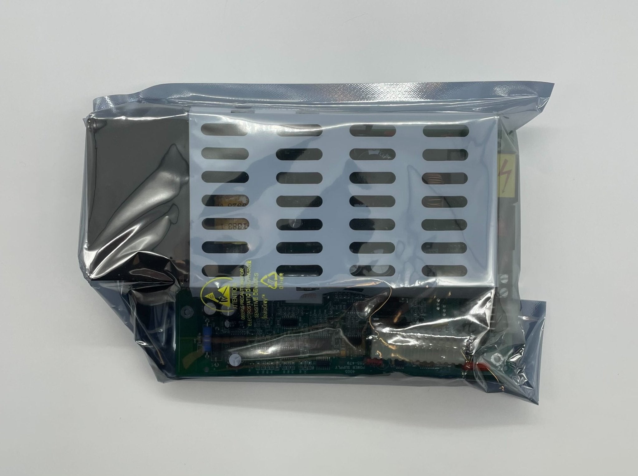 Simplex 8565-479 power supply unit with visible connectors and branding, designed for industrial or electronic applications.