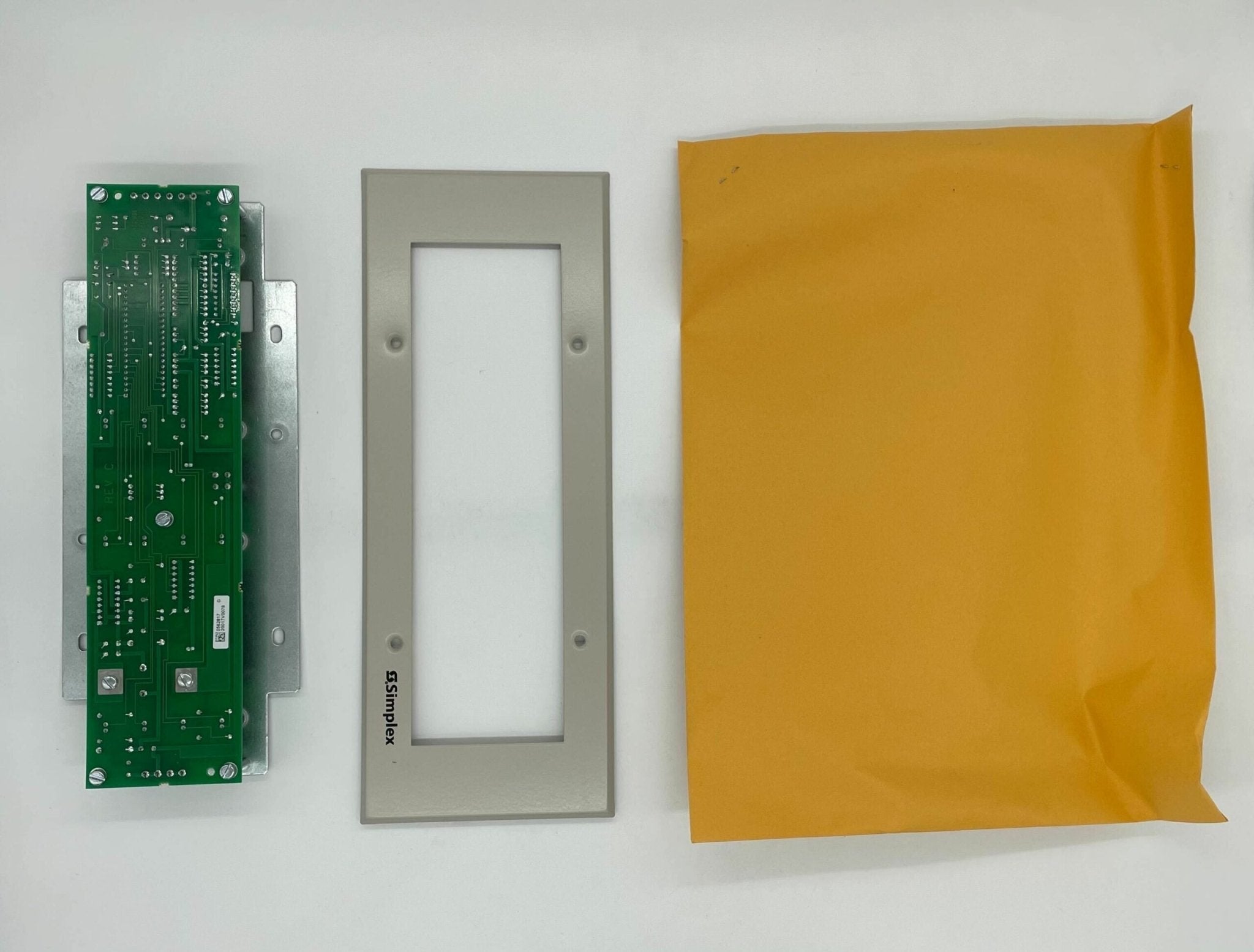 Simplex 4602-9101 fire alarm control panel with digital display and control buttons, mounted on a wall.