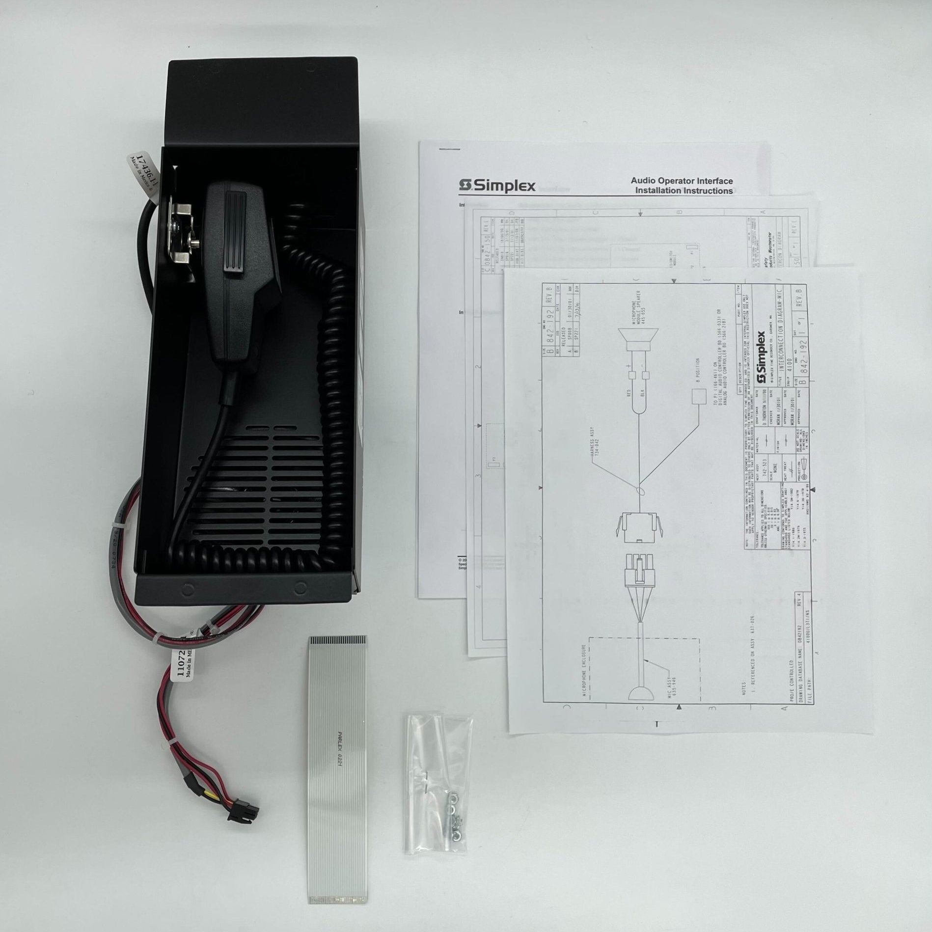 Simplex 4100-1243 fire alarm system sensor with ULC certification, mounted on a wall for fire safety detection.