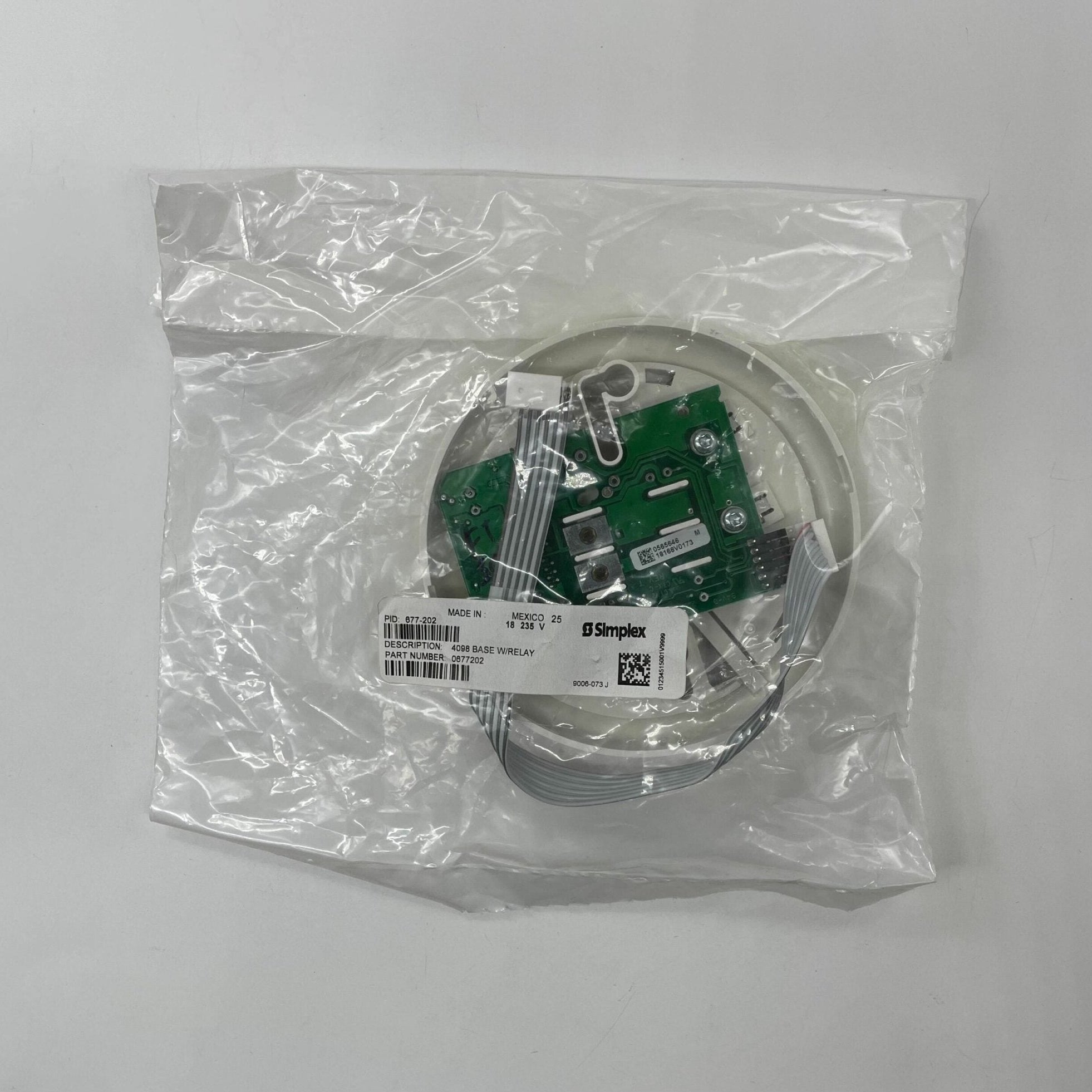 Simplex 677-202 fire alarm sensor with wiring and mounting components for fire alarm system installation.