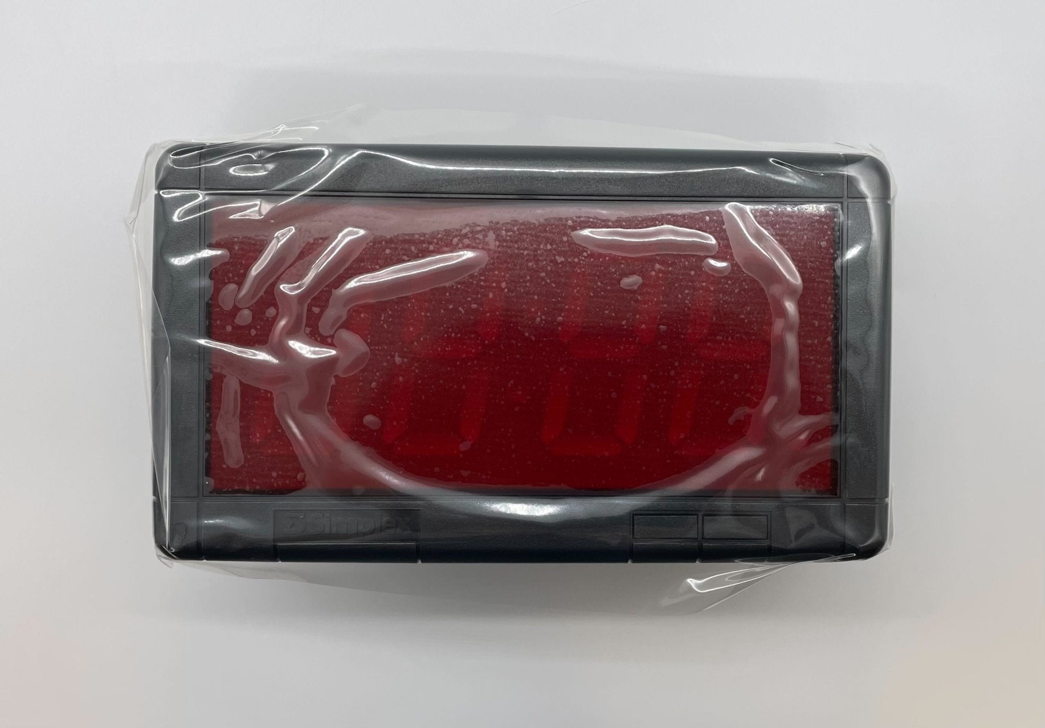 Simplex 6334-9135 fire alarm with digital display, mounted on wall, from Simplex brand, used for fire safety in buildings.