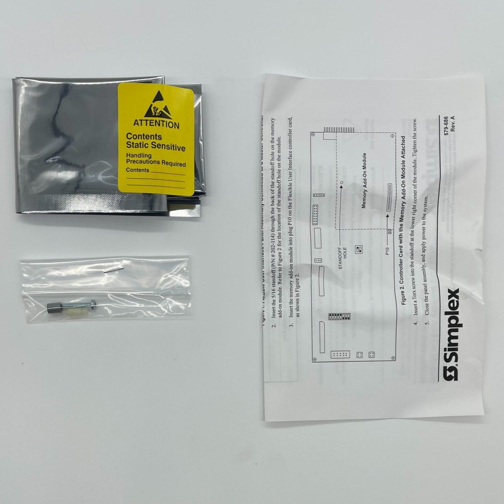 Simplex 4100-0640 fire alarm with a white control panel and indicator lights, mounted on a wall.